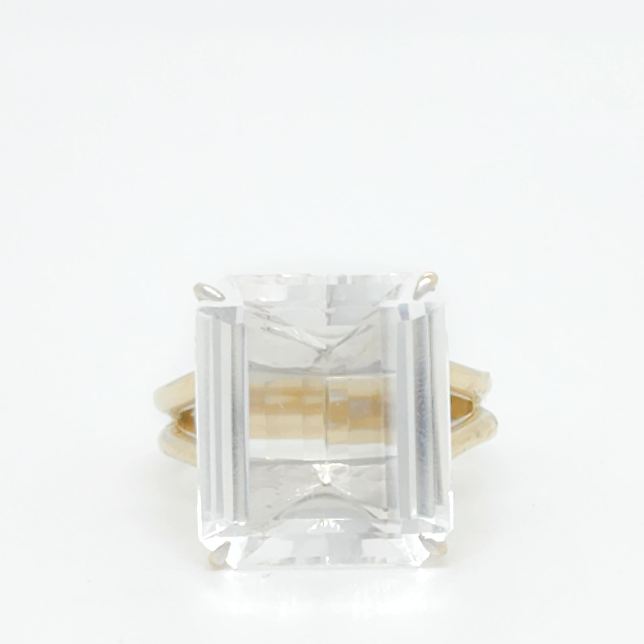 Beautiful H. Stern cocktail ring with a big emerald cut white crystal.  Handmade in 18k yellow gold.  Ring size 7.75.