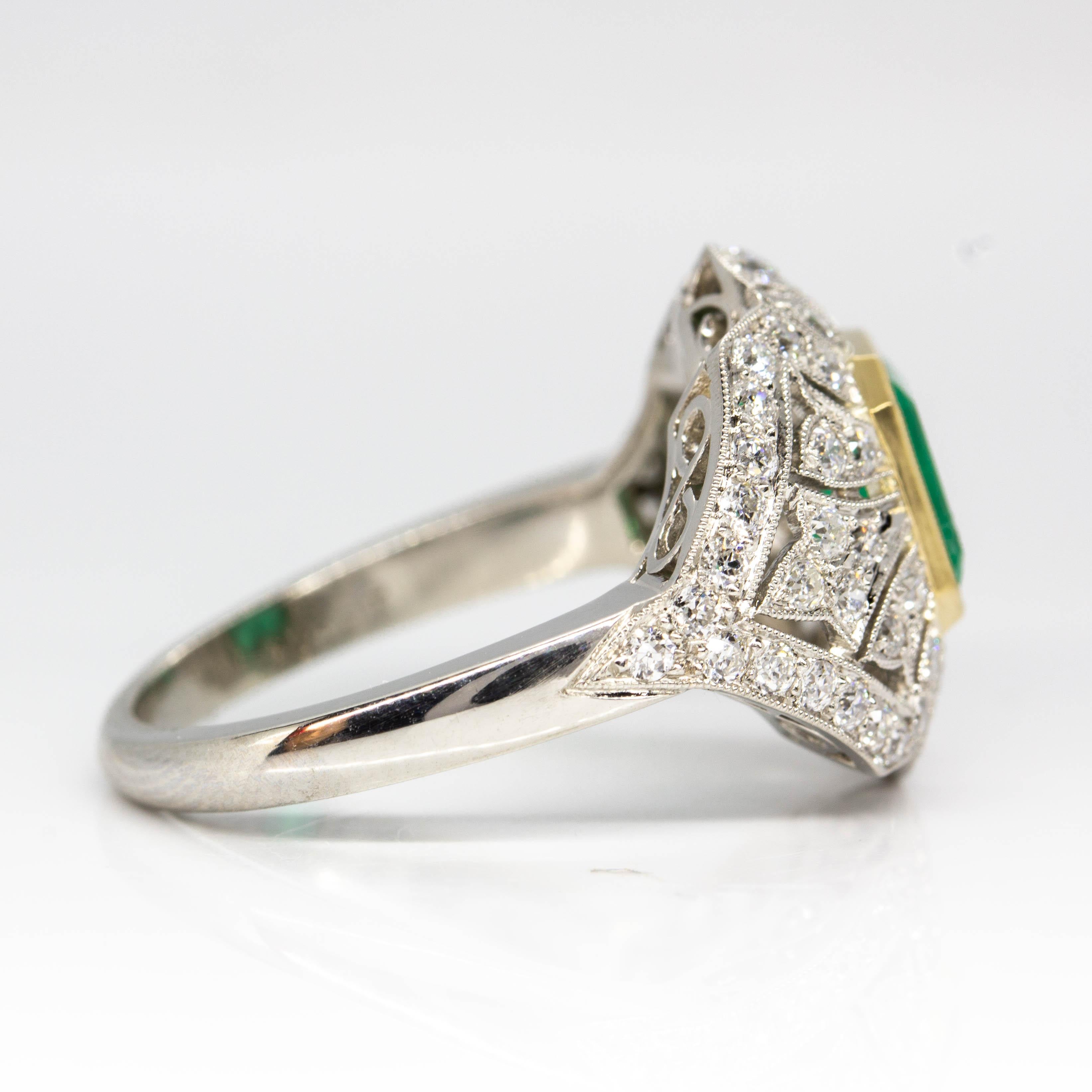 Composition: Platinum 
•	1 Colombian natural emerald 1.15ctw.
•	56 old mine cut diamonds H-VS1 1.05ctw.
Ring size: 7 ¾ 
Ring face measure: 16mm x 22mm 
Rise above finger: 7mm
Total weight: 7.3 grams – 4.6dwt
