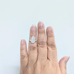 Estate Harry Winston GIA White Diamond Pear Three Stone Ring in Platinum