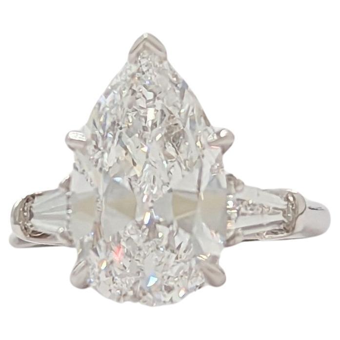 Estate Harry Winston GIA White Diamond Pear Three Stone Ring in Platinum