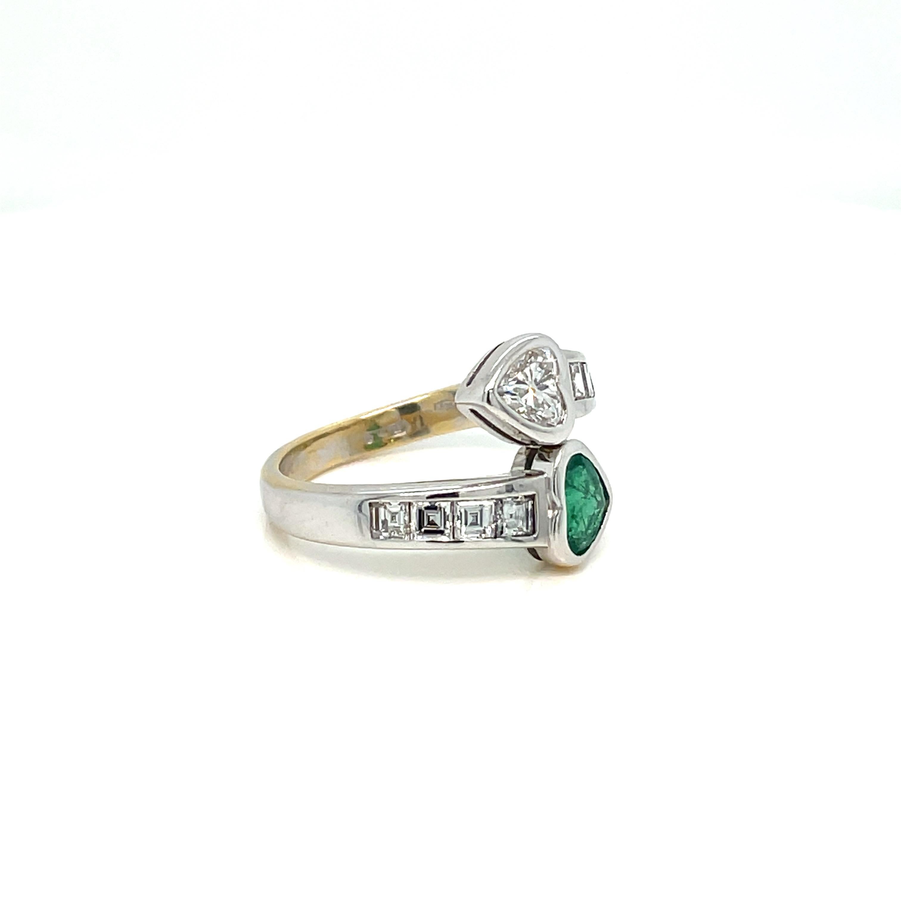 Beautiful and unique 18k white gold 'Vous et Moi' ring set with a Beautiful heart cut fine Colombian Emerald weighing 0.60 carat, and one sparkling heart Cut Diamond weighing 0.60 carat, graded F color Vvs1 clarity, surrounded by eight baguette
