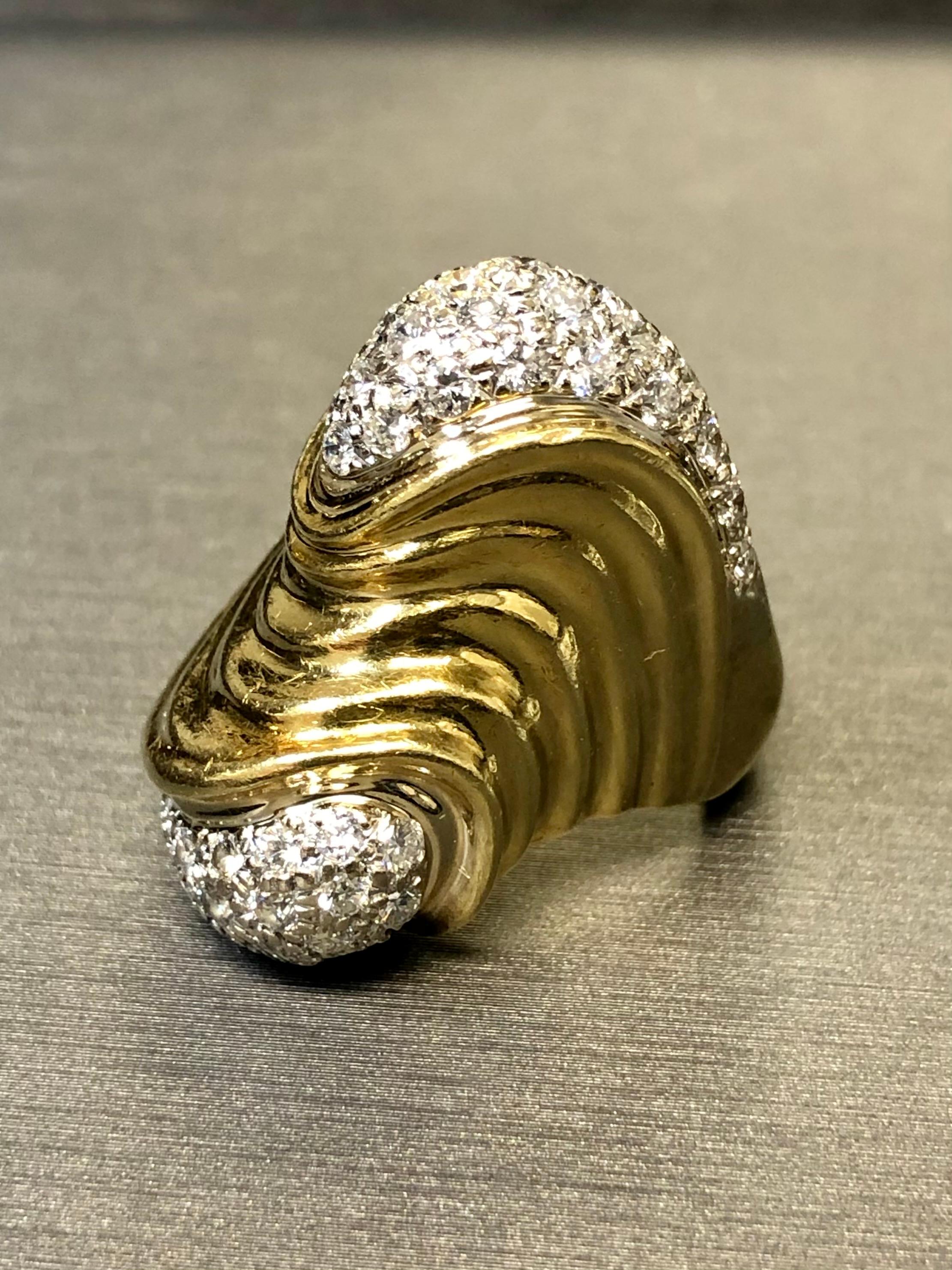An incredibly gorgeous and unique cocktail ring done in 18K yellow and white gold, pave set with approximately 2.50cttw in G-I color Vs1-2 clarity round diamonds. Absolutely a bespoke piece crafted by hand for the original customer. This is likely a