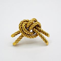 Spilla Hermes Estate 1950 con nodo in oro giallo 18 carati