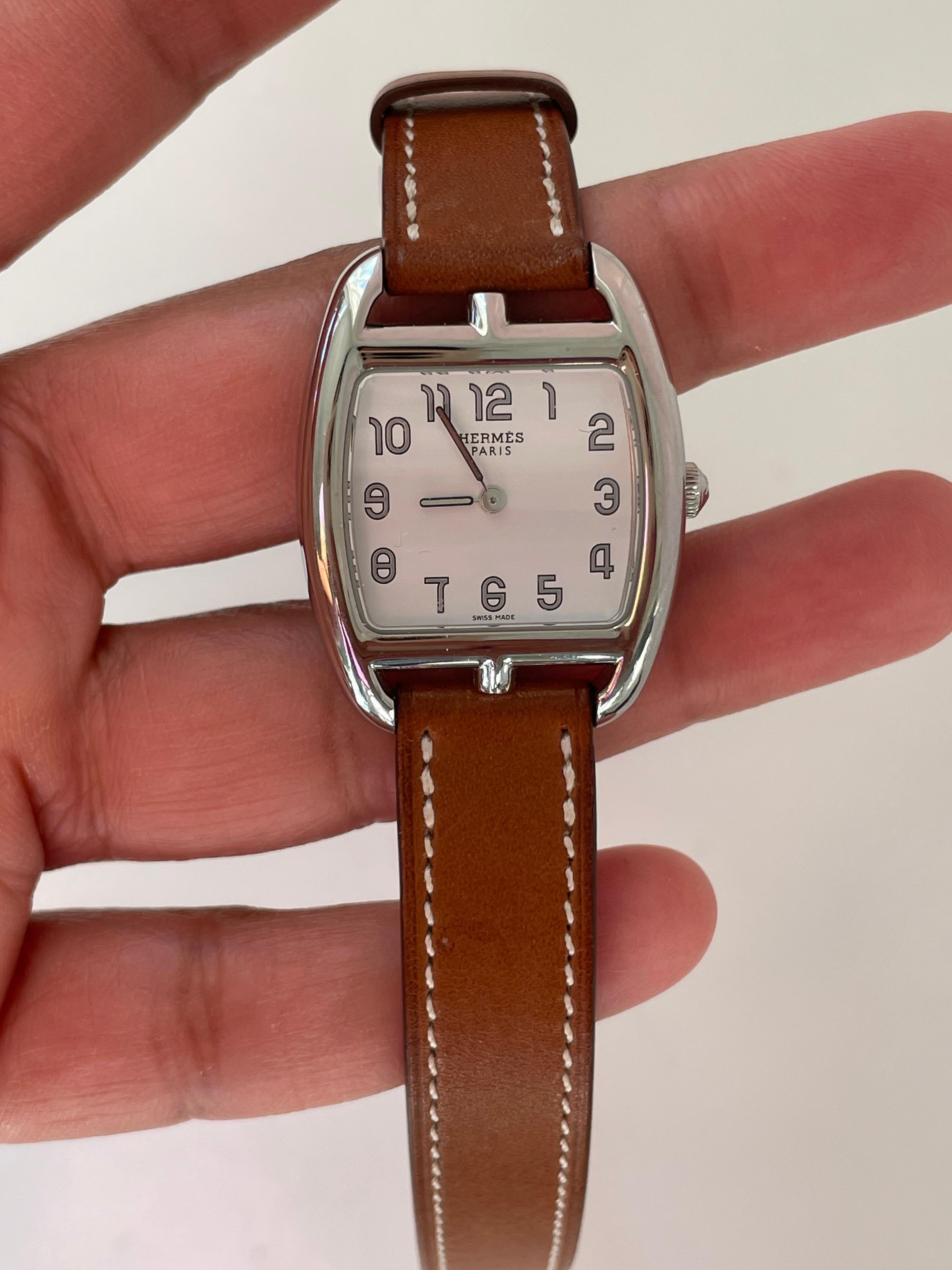Gorgeous and classic Hermes cape code watch. Excellent condition. 23 x 23 mm. Gold strap.