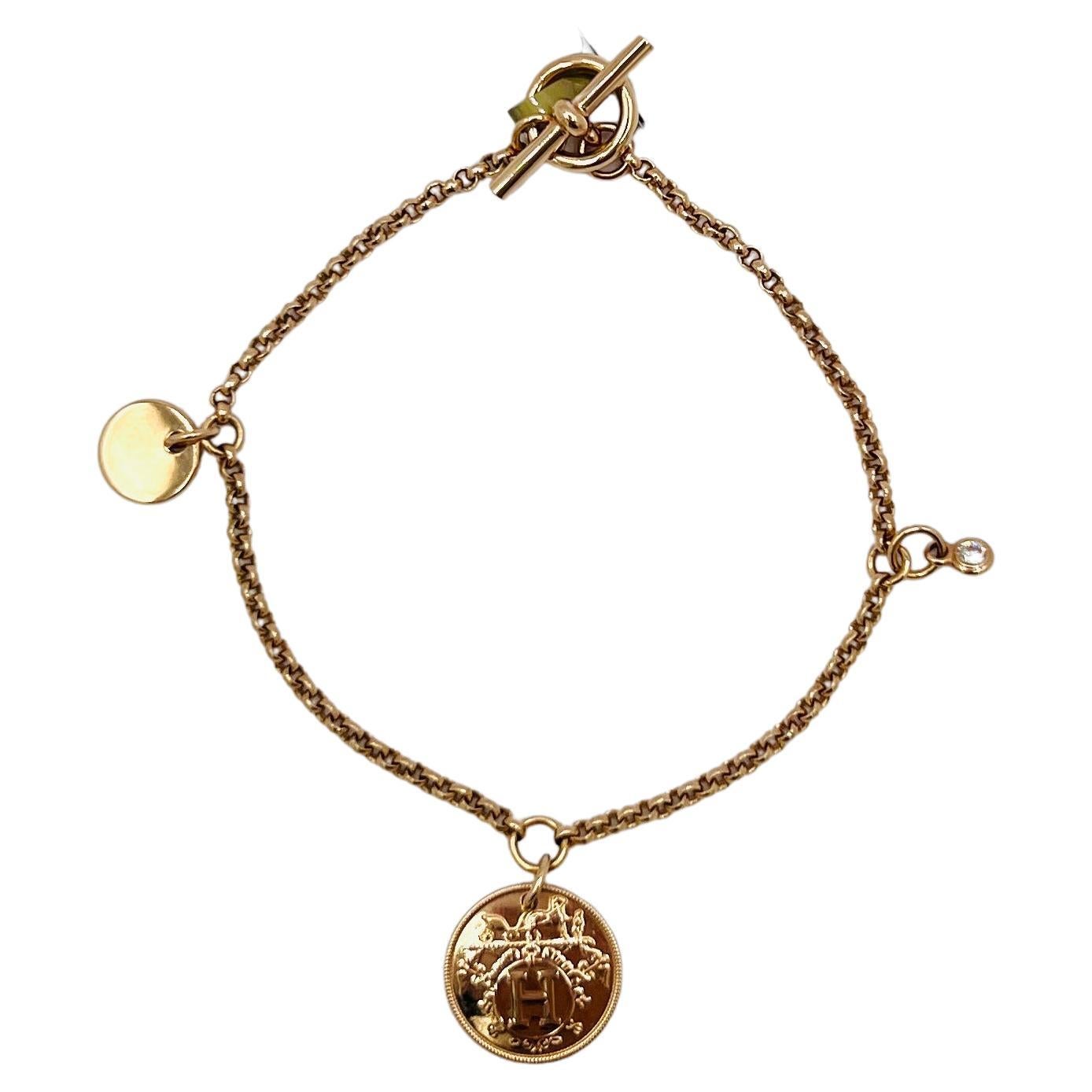 Bracciale con charme Hermes Estate in oro rosa 18 carati