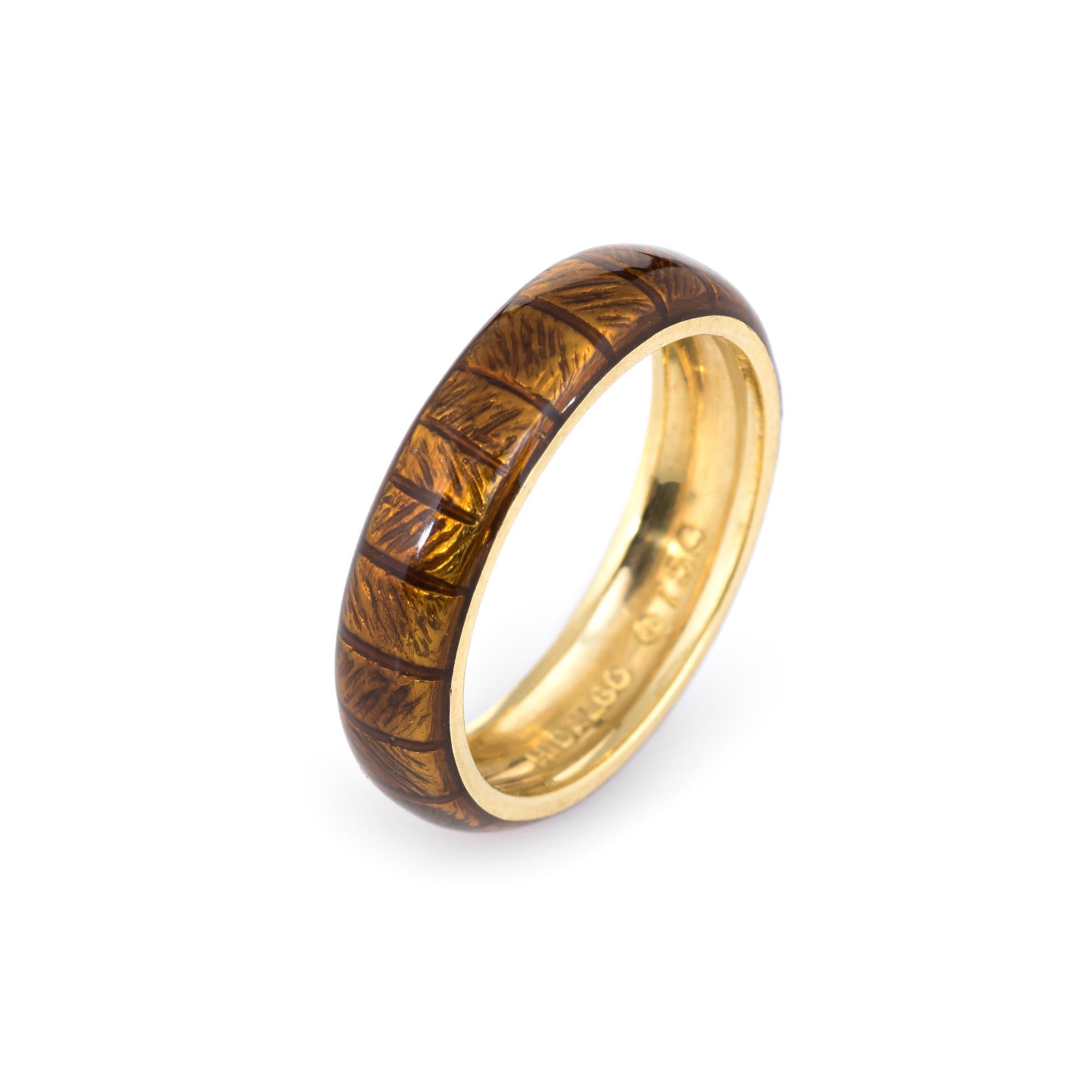 Finely detailed estate Hidalgo band crafted in 18 karat yellow gold. 

Brown enamel adorns a textured band (in excellent condition and free of cracks or chips).  

The simple and sweet ring is ideal worn alone or stacked with your fine jewelry from