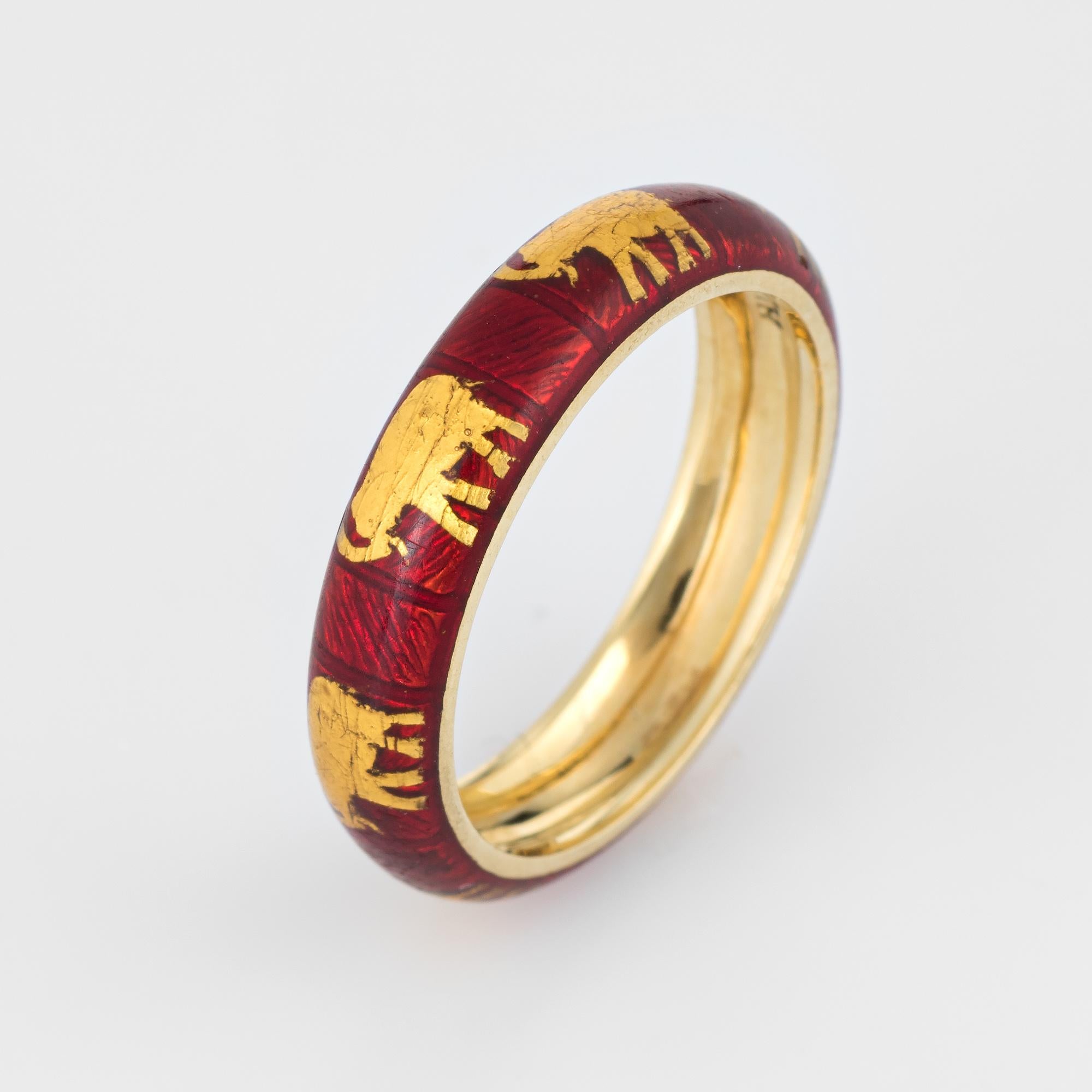 Finely detailed Hidalgo elephant ring crafted in 18 karat yellow gold. 

The elephants are rendered in gold against a red enamel base around the entire band.

The ring is in excellent condition. 

Particulars:

Weight: 4.3 grams

Stones: N/A. 

Size