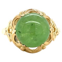 Anello con cabochon di granato verde idrogrossulare di proprietà, oro giallo 14 carati