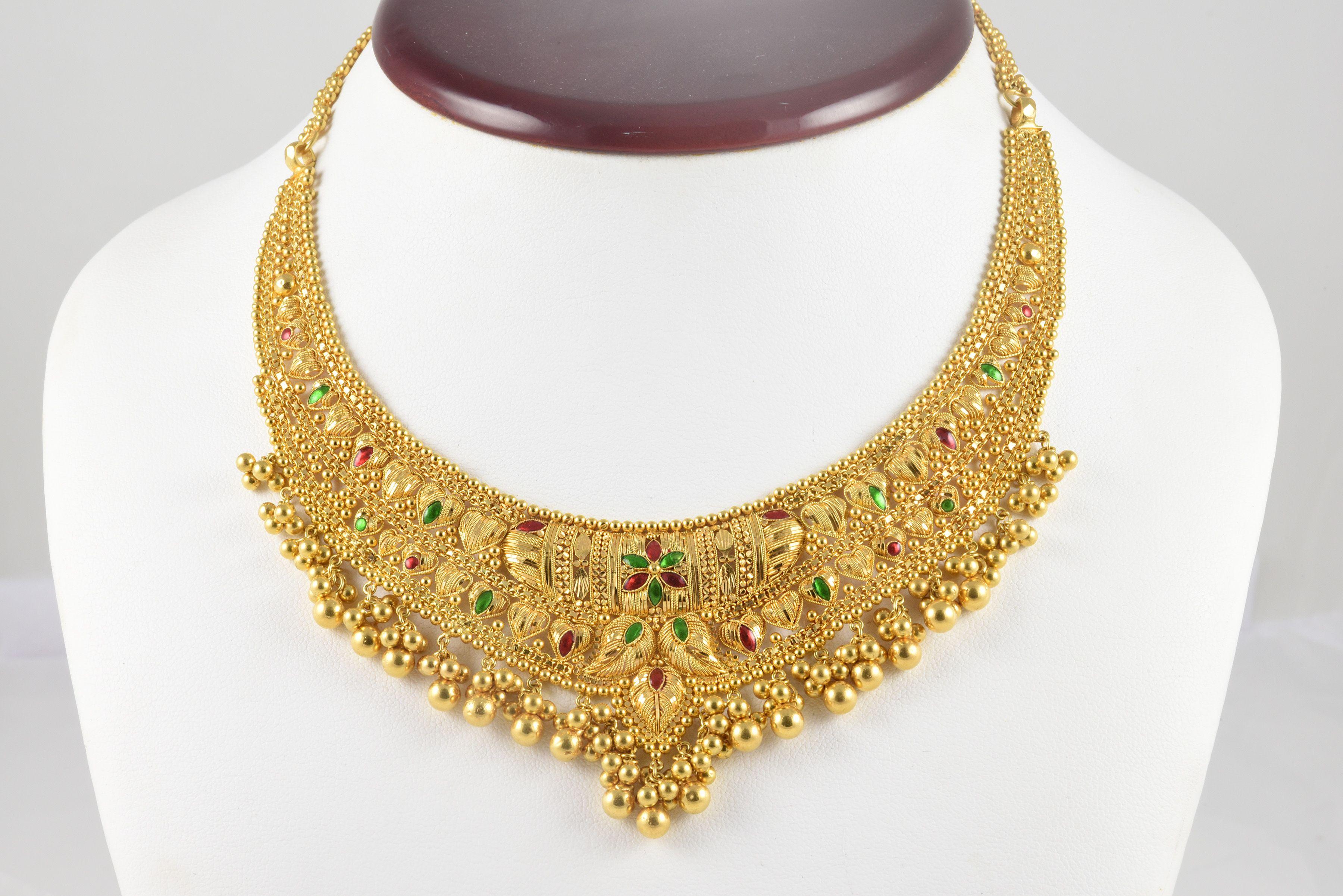 Estate Indian 20kt yellow gold bib necklace embellished with red and blue enamel and gold fringe. 