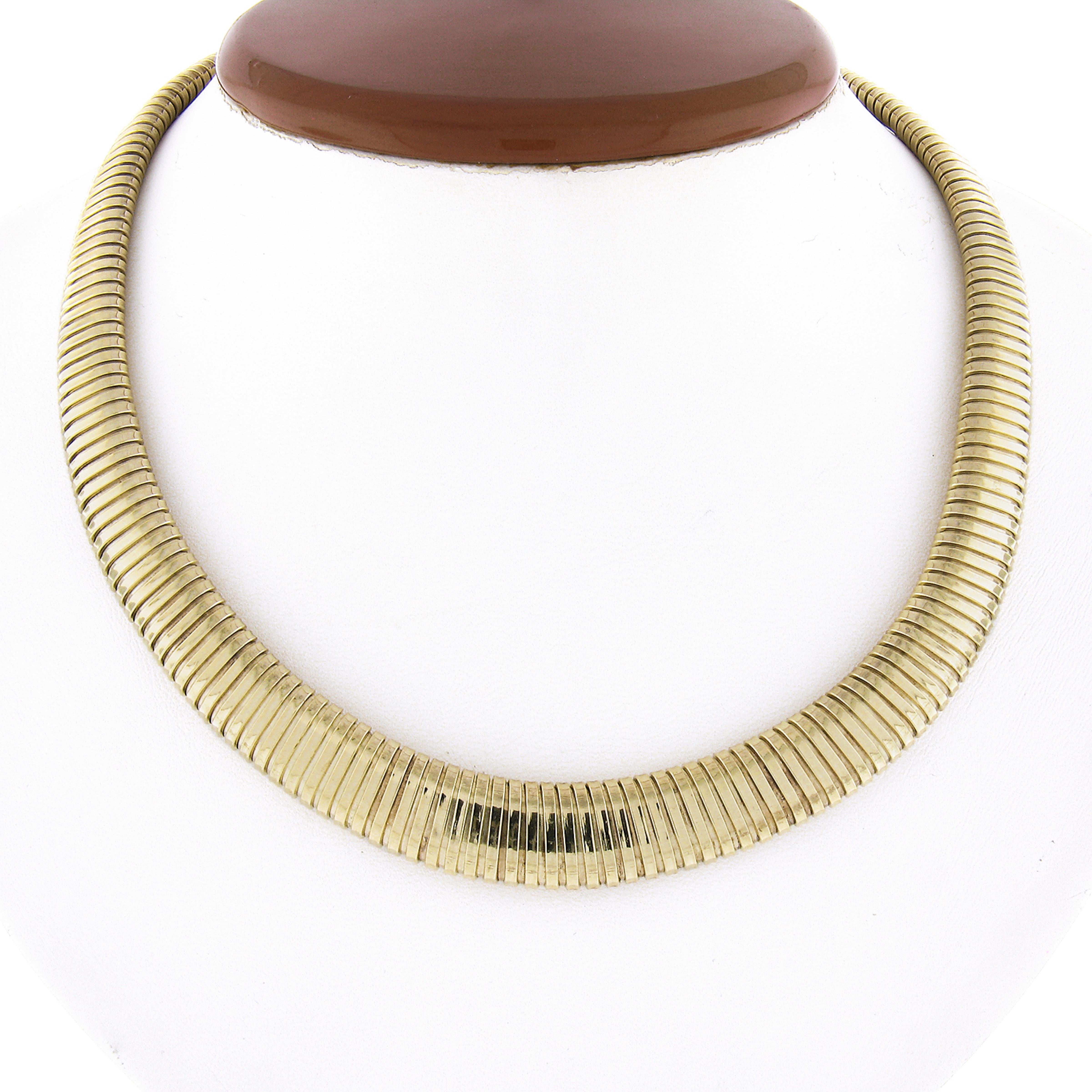 Here we have an Italian excellent condition, 16 inch polished accordion snake link chain necklace, which is graduated in width from 6.4mm to 12.1mm. The chain is solid 14k yellow gold and closes with a push clasp and safety latch. This necklace