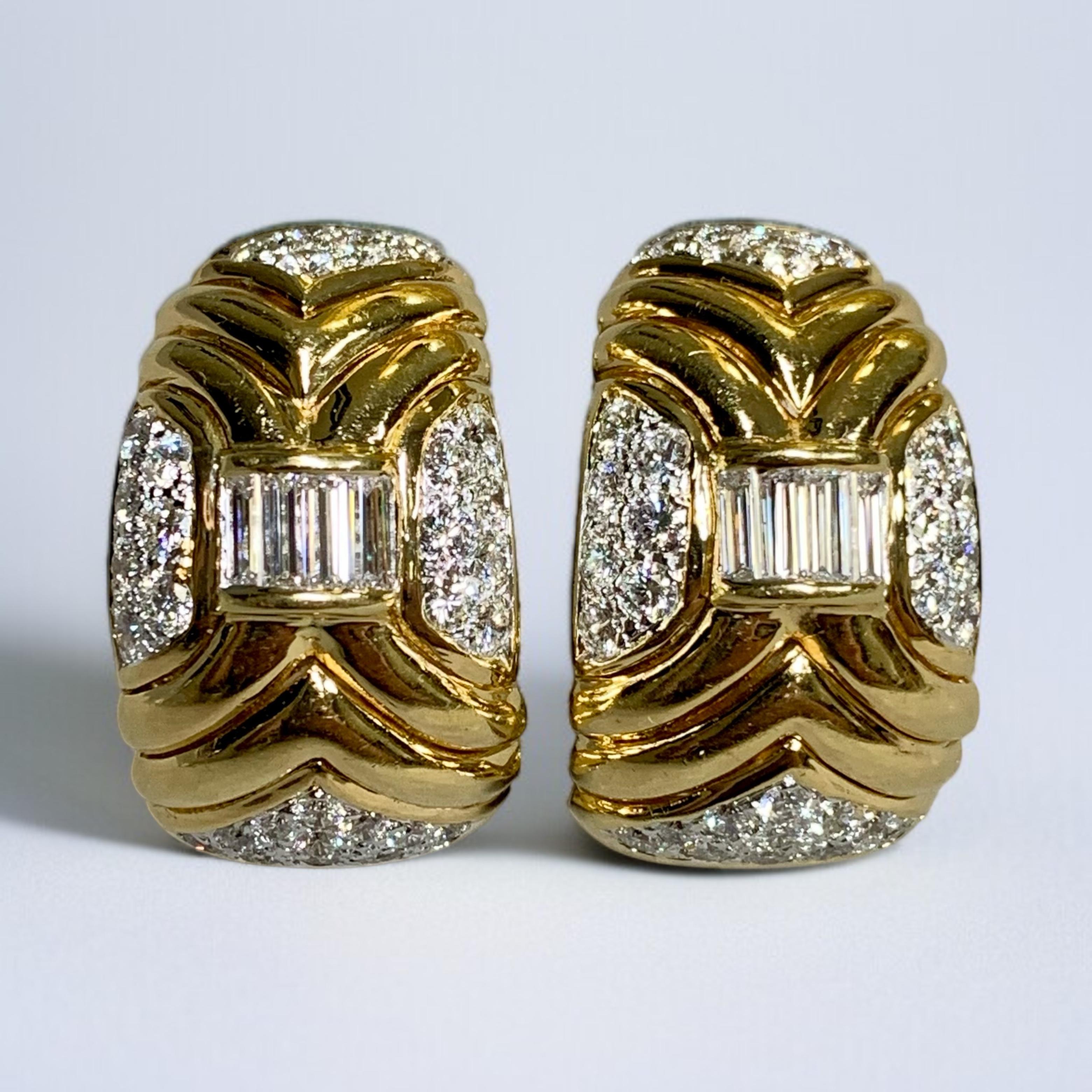 Beautifully made 18K huggie earrings channel set with large baguette and pave diamonds. Total approximate diamond weight is 4.50cttw and all stones are G-I color and Vs1-2 clarity diamonds.

Dimensions/Weight
1.1” long by .6” wide. Weighs