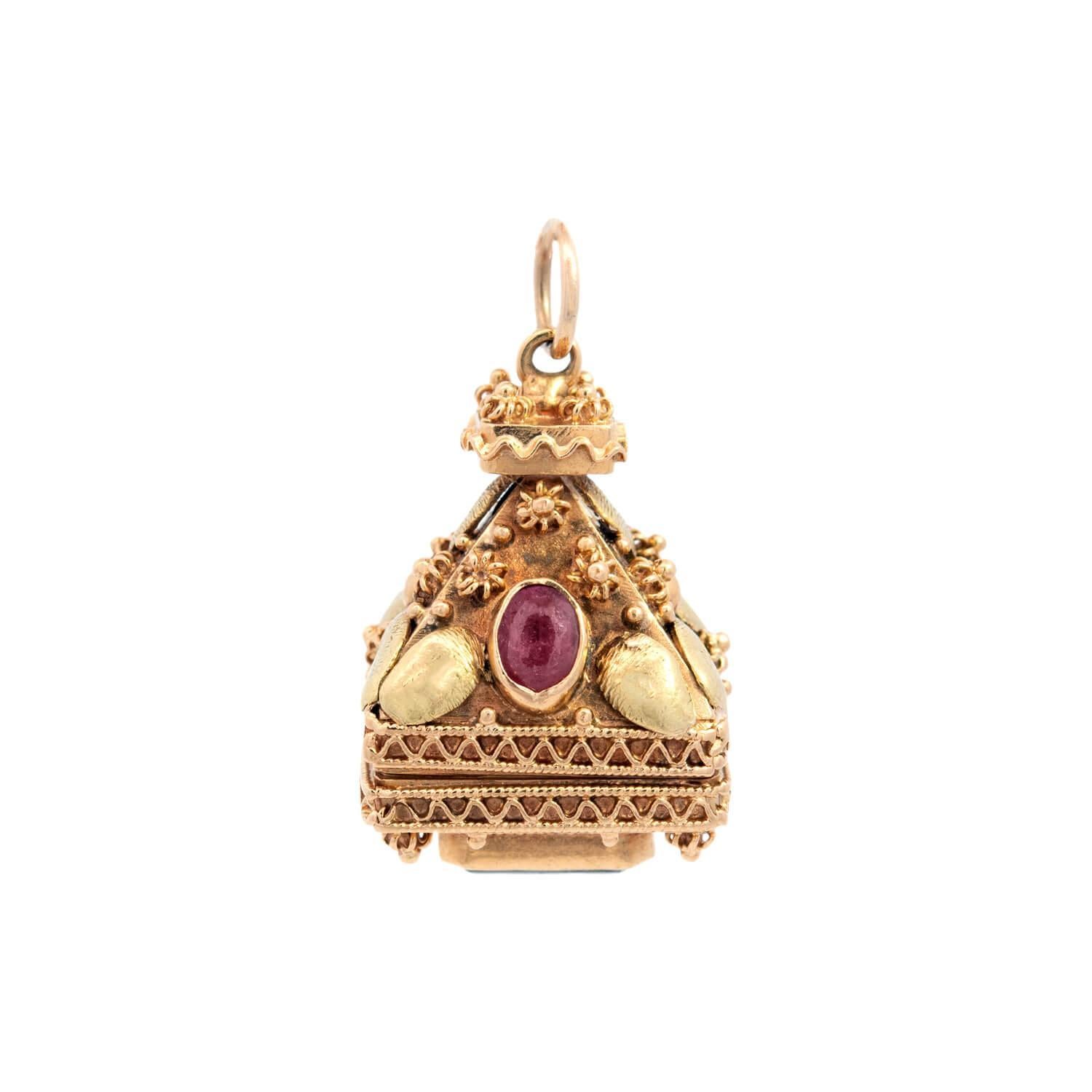 A fob is an adornment or a seal that hangs from the ribbon or chain of a pocket watch. Its purpose is to decorate or add weight to the watch chain itself making it easier for the watch to be withdrawn from a pocket. 

A very unusual and