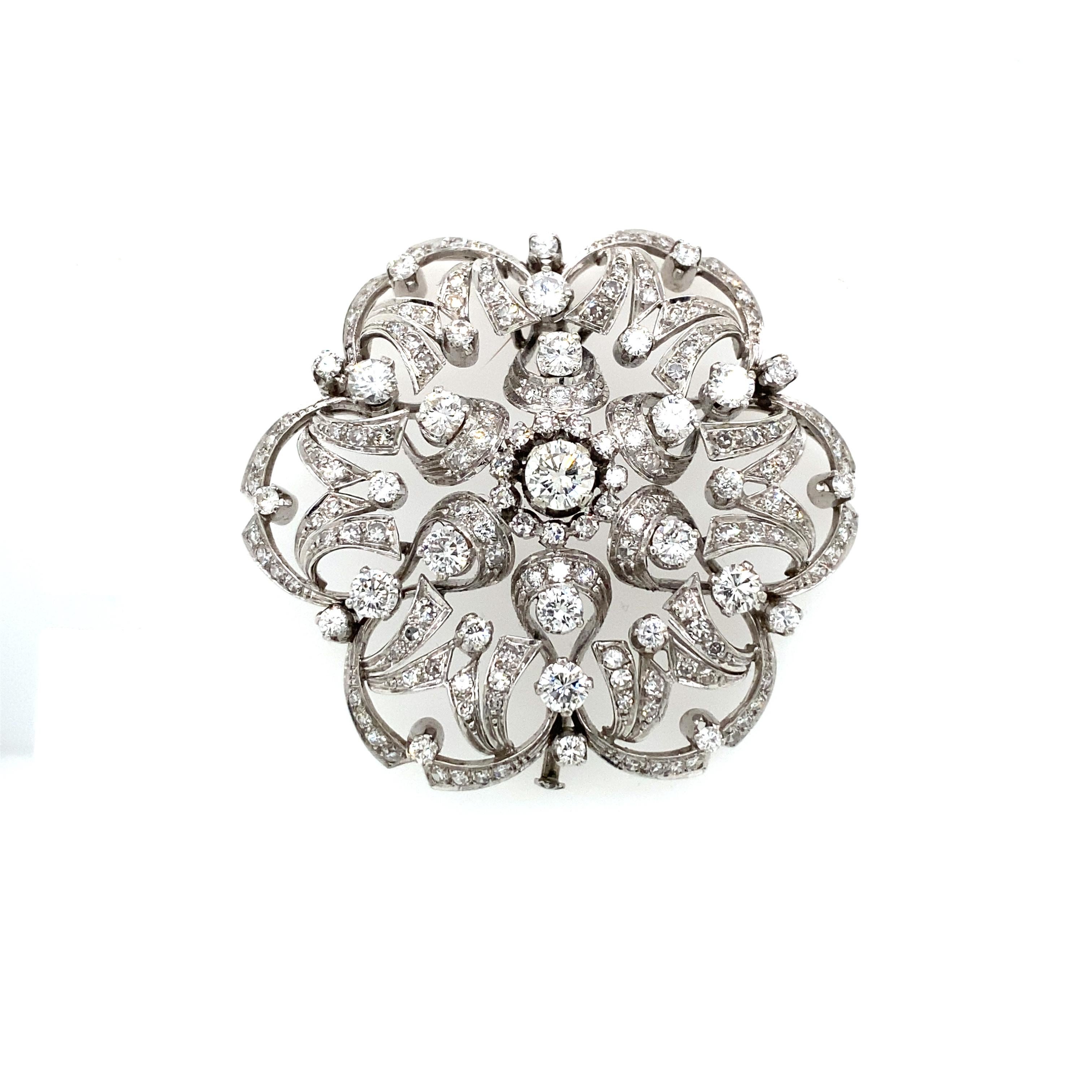 Important Italian Handcraft in 18k white gold Flower Brooch hallmarked 652 AL (Valenza), set with approx. 5.50 ct. of round brilliant cut diamonds G color VVS clarity. This piece is designed and crafted entirely by hand in the traditional way, using