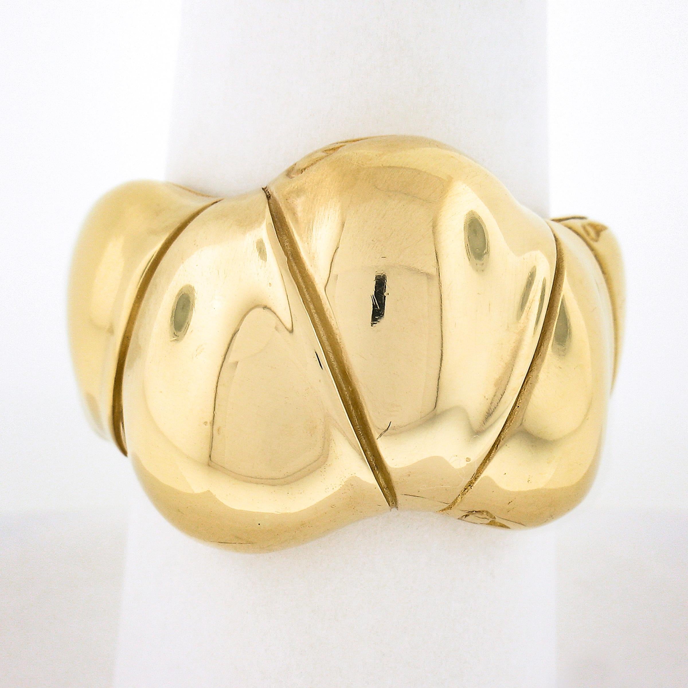 This beautiful ring by John Hardy is from their Bamboo collection and features a puffed design that's nicely detailed and has a high polished finish throughout. This wide ring wears comfortably has a lot of finger coverage. It remains in excellent
