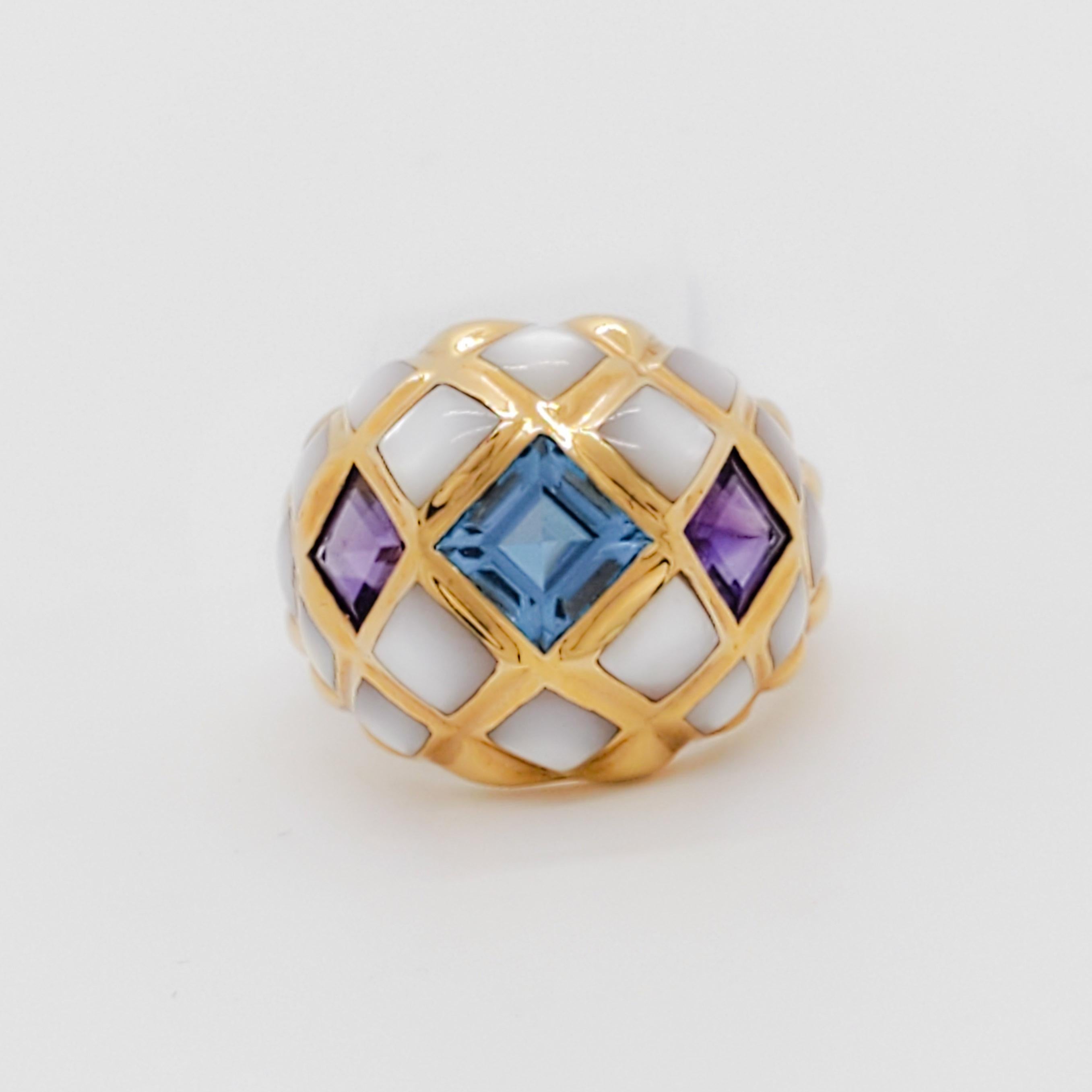 Beautiful Kabana cocktail ring with white mother of pearl, square blue topaz and square amethyst.  Handmade in 14k yellow gold.  