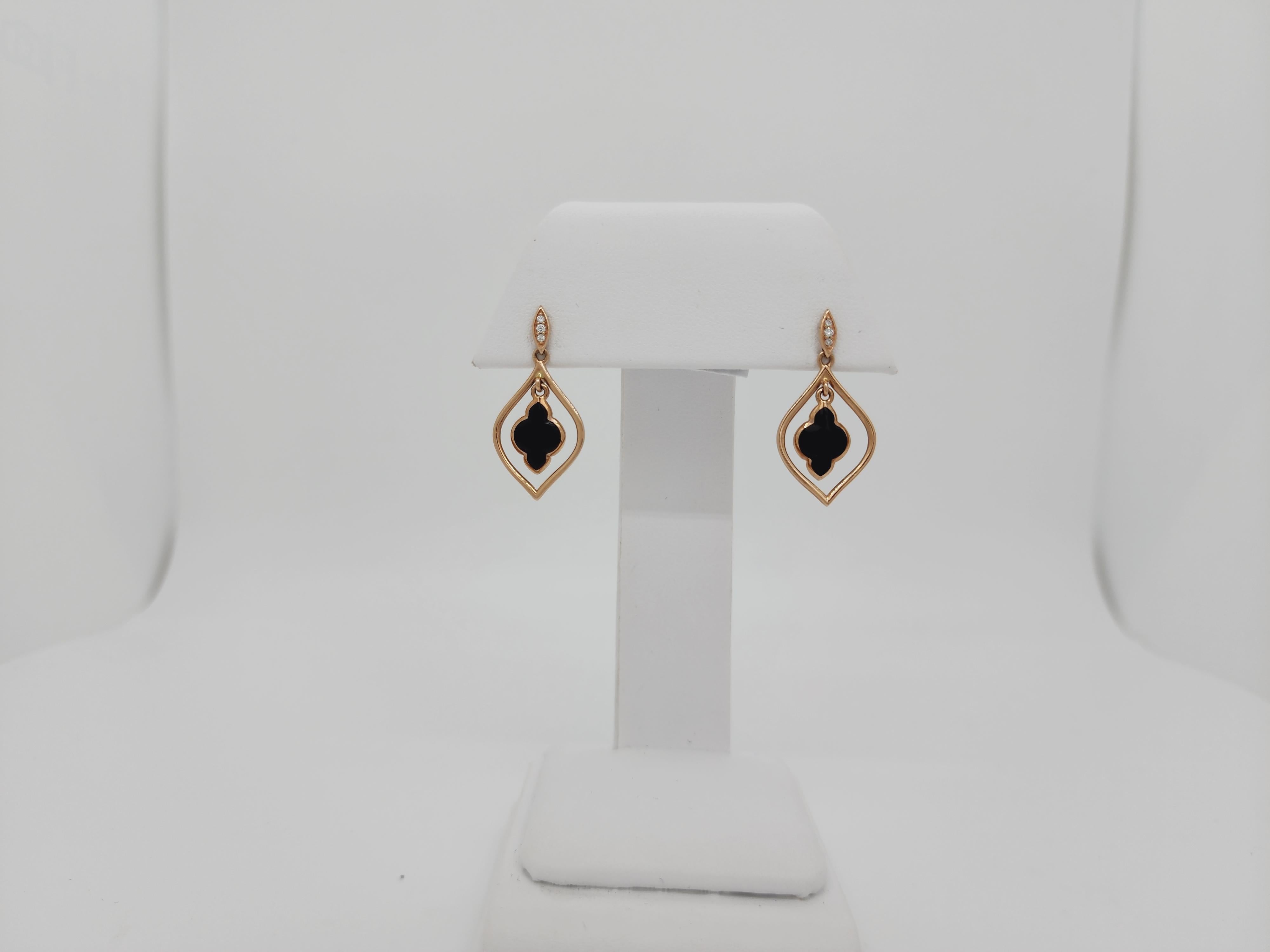 Beautiful estate Kabana earrings with onyx free shape stones and 0.04 ct. white diamond rounds.  Handmade in 14k yellow gold.  Made in the USA.