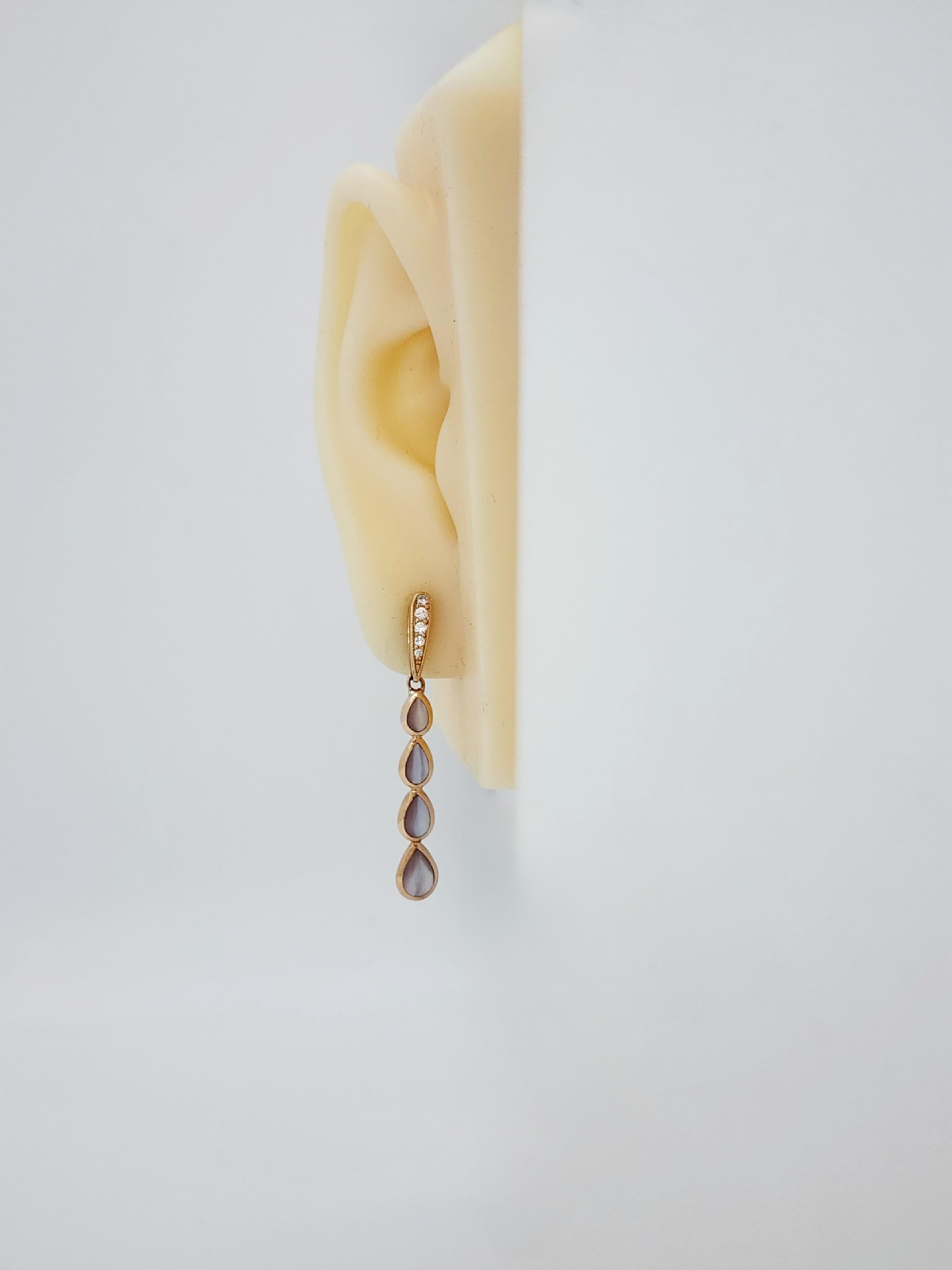Gorgeous estate Kabana earrings with 8 big pear shape mother of pearls and 0.14 ct. of good quality white diamond rounds.  Handmade in 14k rose gold.