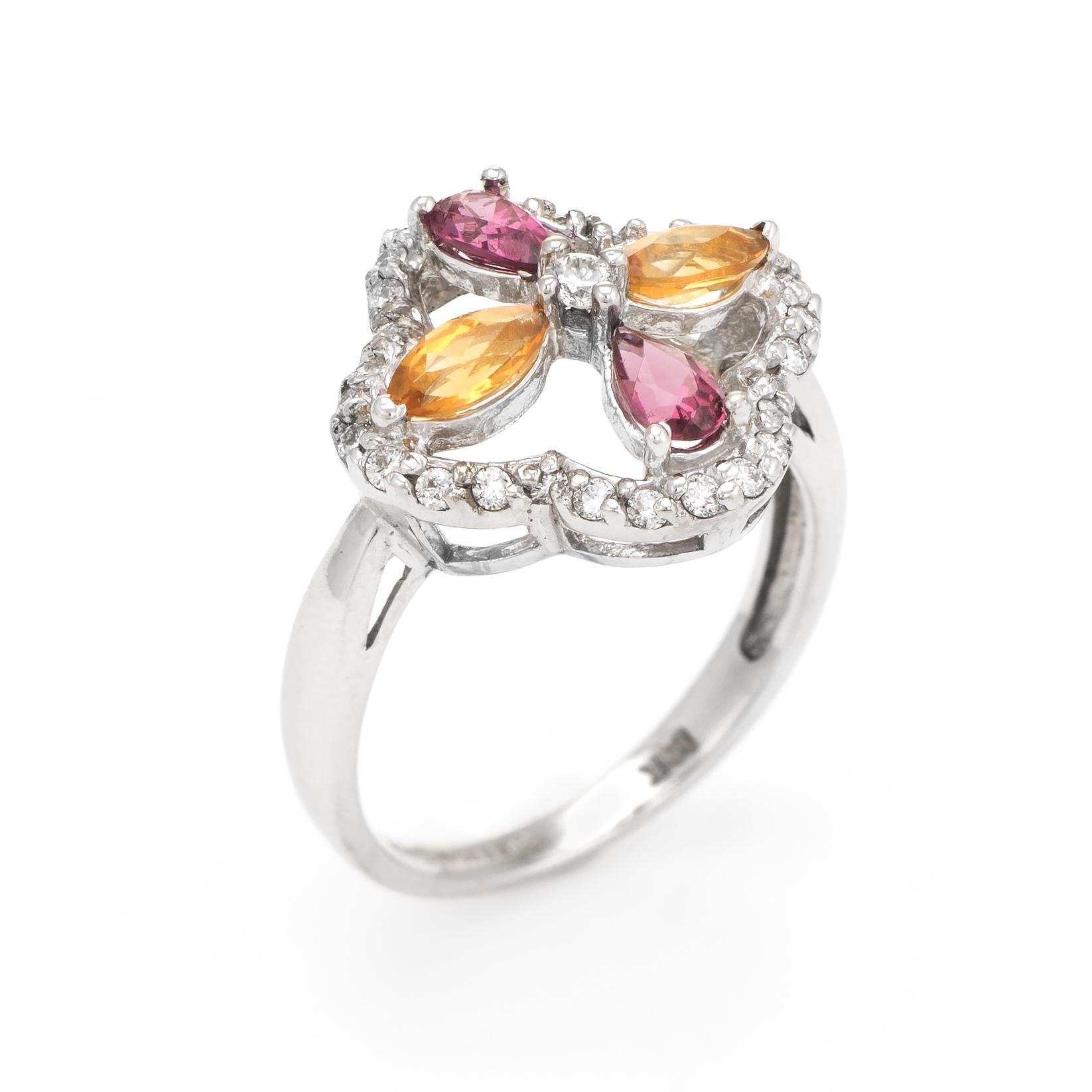 Finely detailed estate Kate Mc Cullar cocktail ring, crafted in 14 karat white gold. 

Pear cut rhodolite garnets are estimated at 0.18 carats each (0.36 carats total estimated weight) and marquise cut citrines are estimated at 0.18 carats each