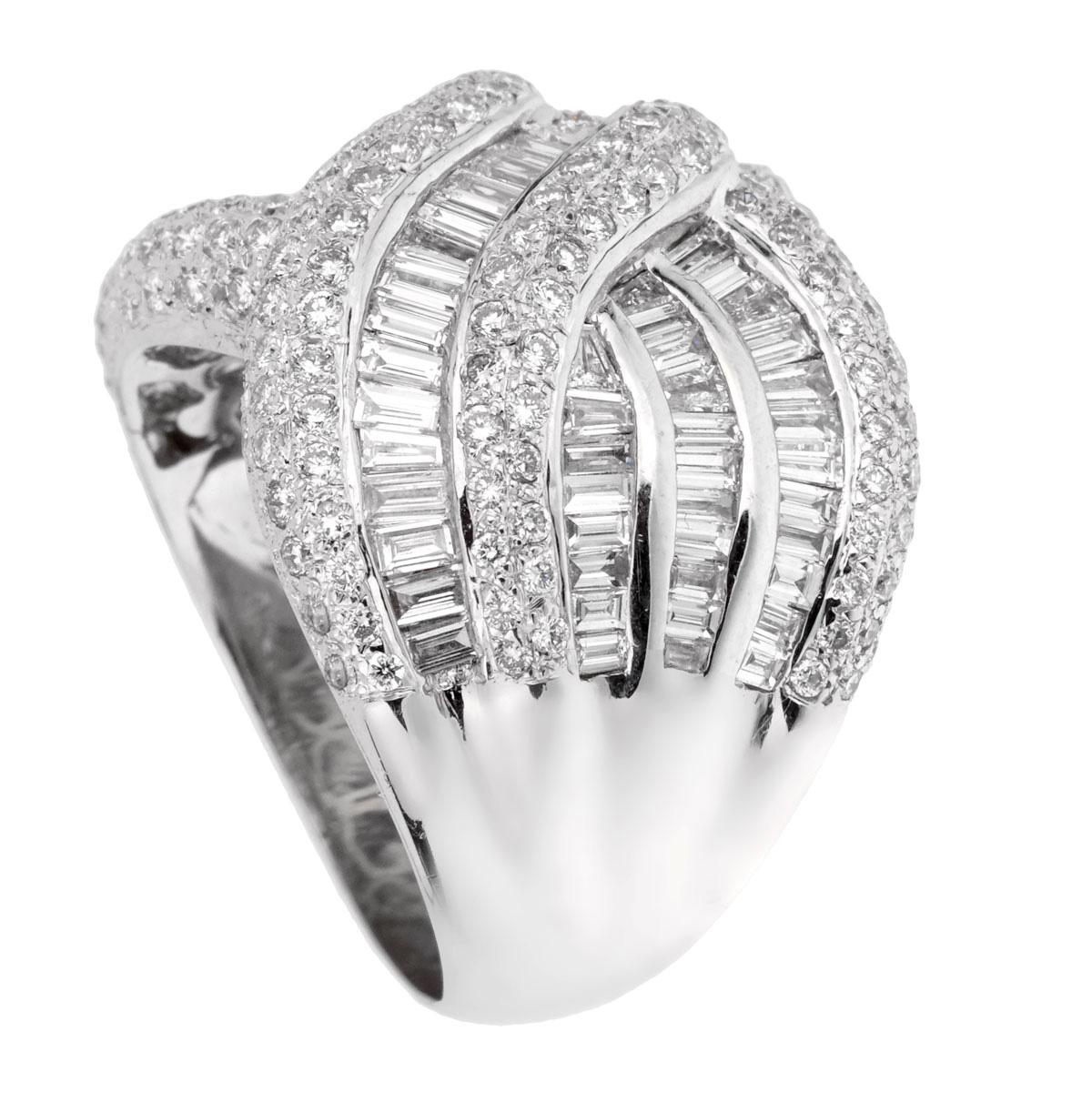 A fabulous cocktail ring set with baguette diamonds and round brilliant cut diamonds in shimmering white gold. The ring measures a size 8 and can be resized.
