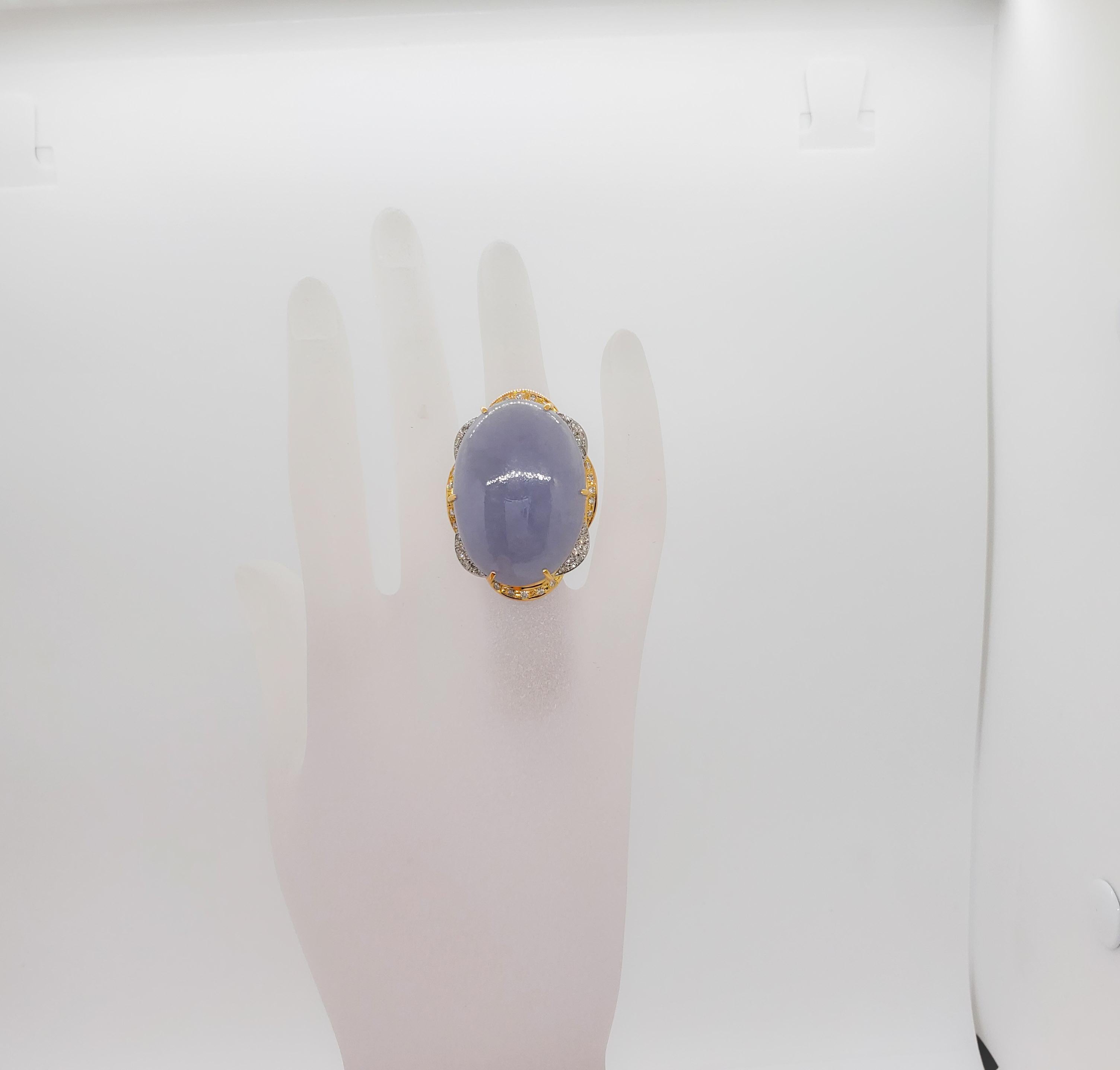 Gorgeous 70.68 ct. lavender jade oval cabochon with 0.73 ct. white diamond rounds.  Handmade 18k yellow gold and platinum mounting.  Ring size 6.
