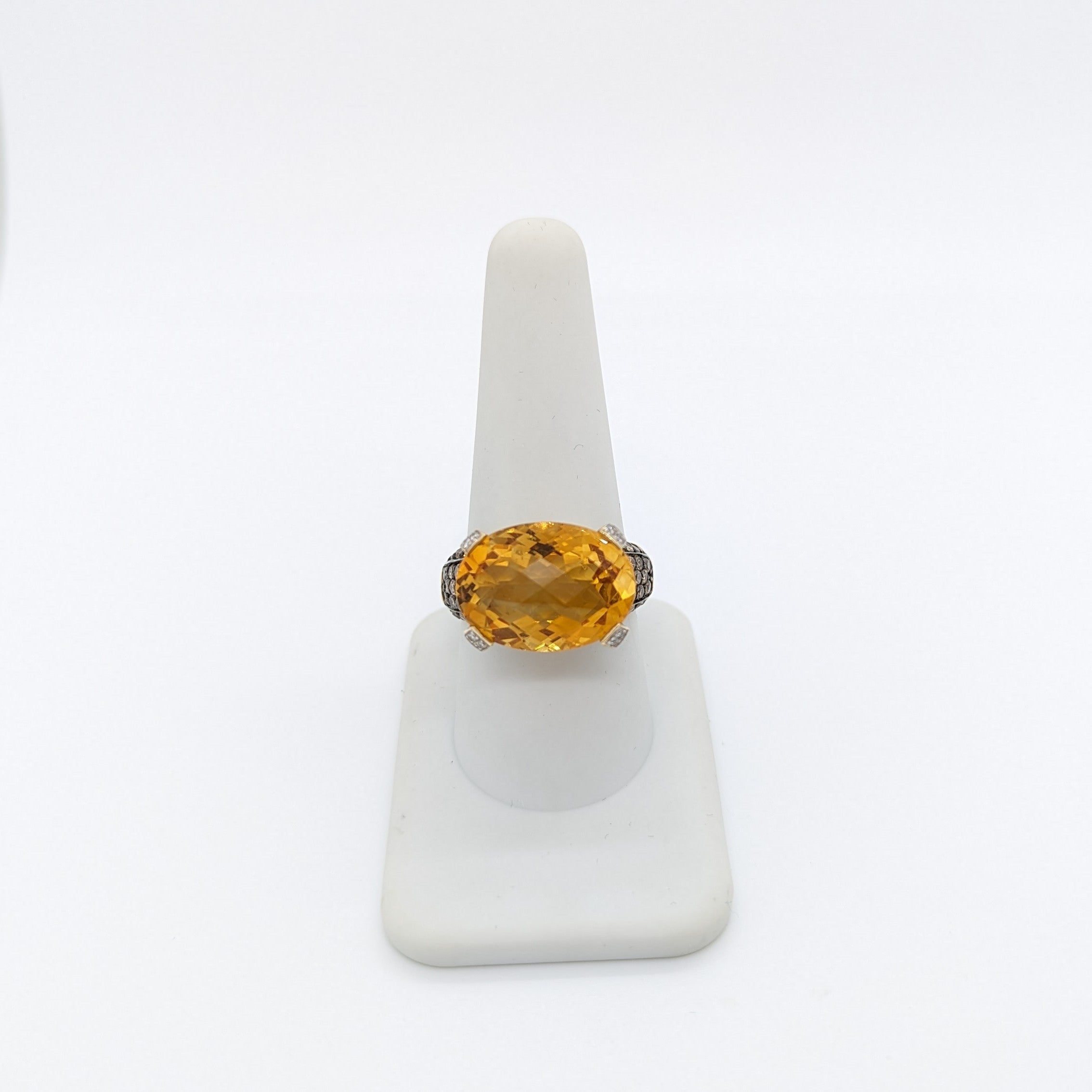 Gorgeous estate Levian cocktail ring with a big citrine oval, champagne, and white diamond rounds.  Handmade in 14k yellow gold.  Ring size 9.25.