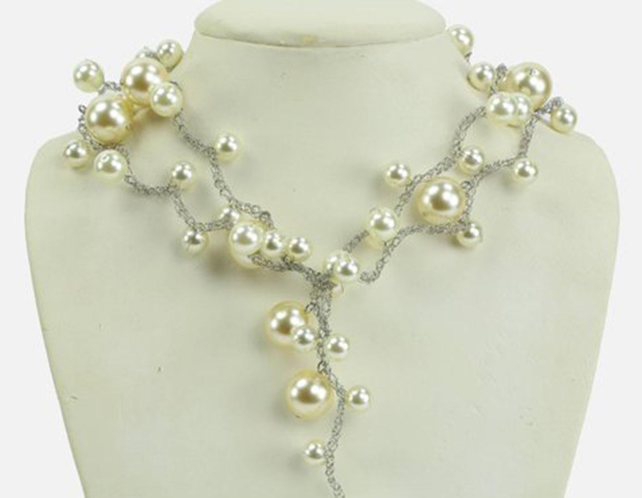 Long Elegant and Stylish Vintage Necklace made of graduated round Faux White Pearls on braided stainless steel wire chain; approx. pearl sizes: large 17mm; medium 12mm and small beads 7.5mm; approx. length of Necklace: 46