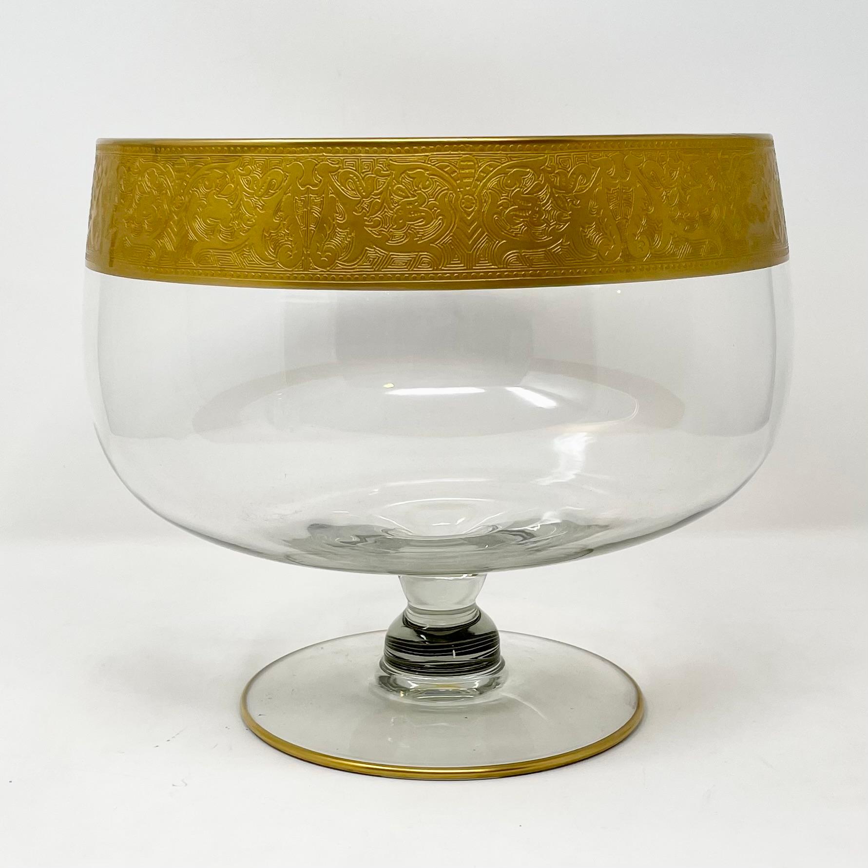 Estate lotus design 22 karat gold leaf etched crystal punch bowl with ladle & 12 glasses, circa 1940-1950.
Measures: 1 Punch Bowl: 8 1/2