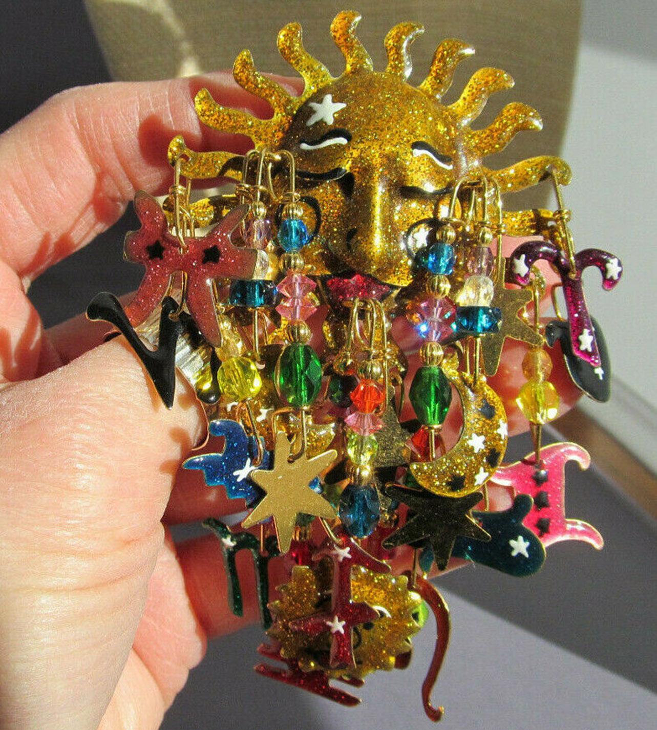 Large Funtabulous Enamel Celestial Sun Charm Dangle Designer Brooch signed: LUNCH AT THE RITZ; This “Fun in the Sun” brooch epitomizes vintage charm and personality! Measuring approx. 2