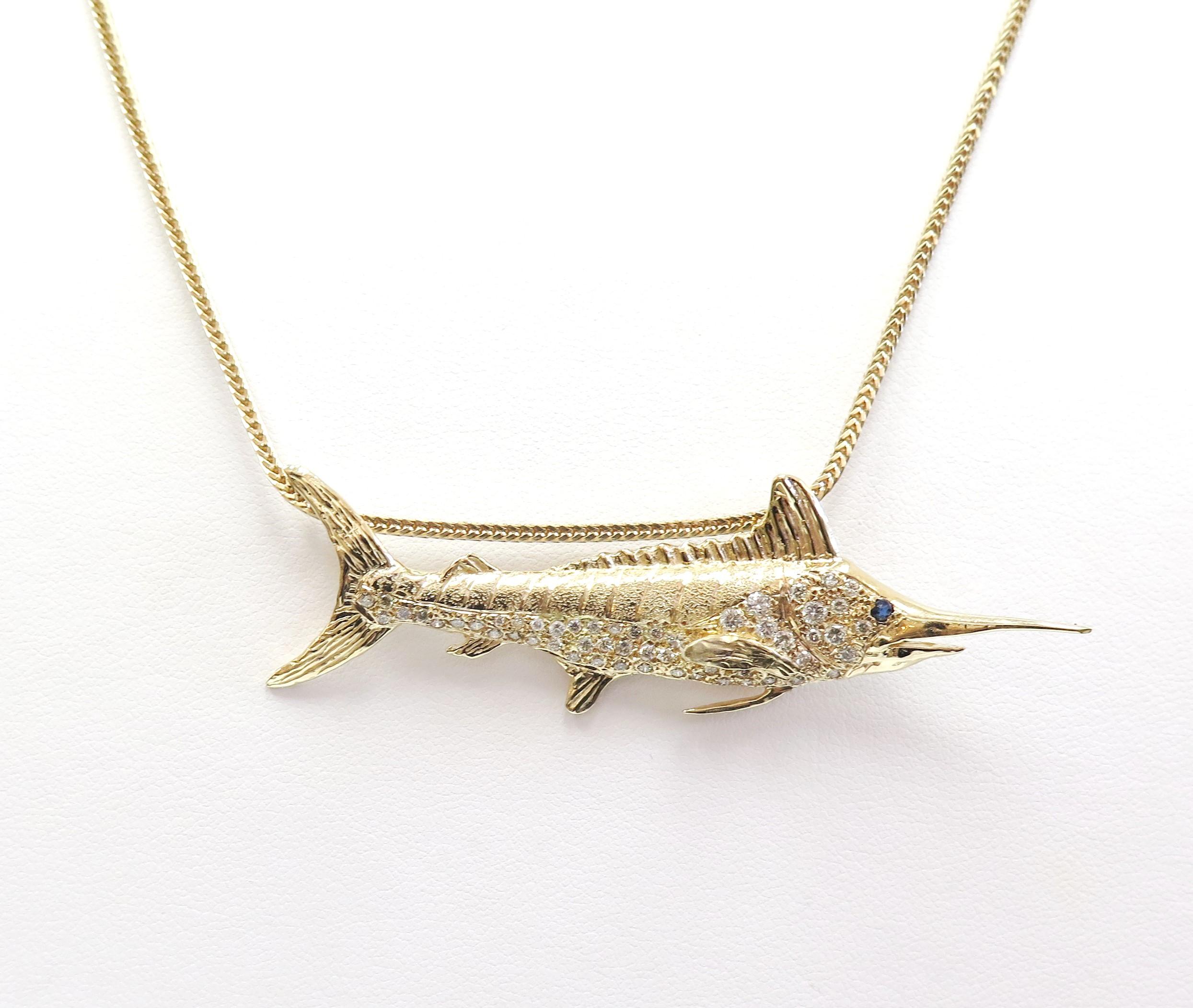 This stylish fish pendant will swim its way right into your heart. Crafted in cool 14 Karat yellow gold, this beautiful Marlin shines with a sapphire accent as its eye and 0.75 Carats of shimmering diamonds set gracefully along it's sleek body.

Can