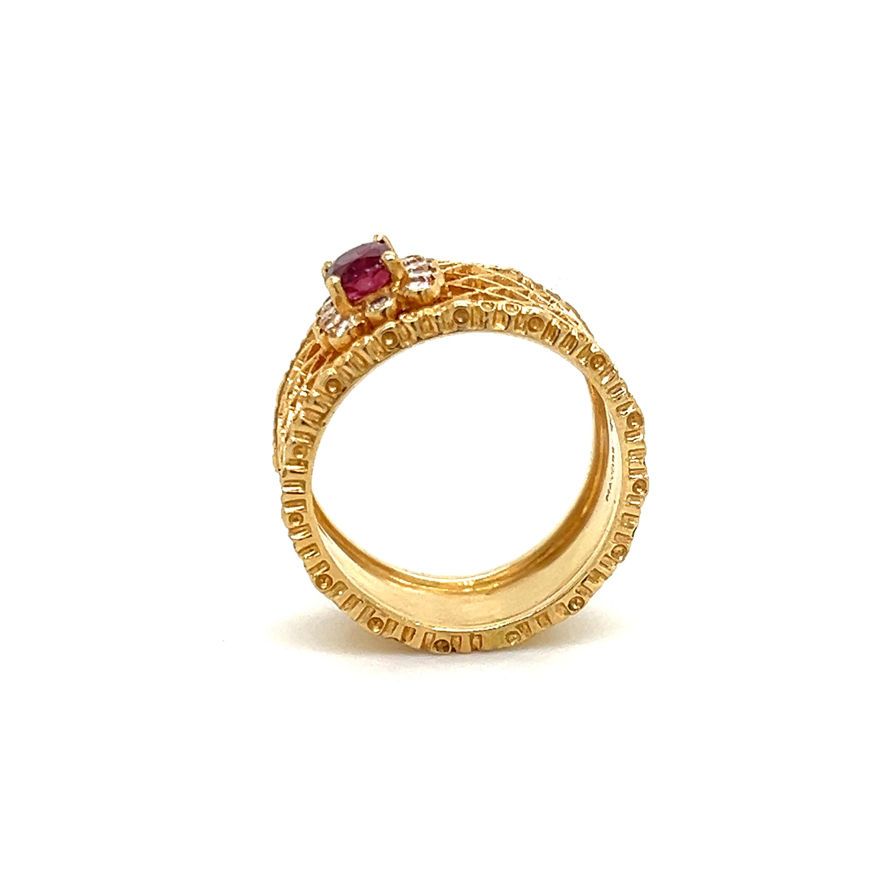     Beautiful estate cocktail ring crafted in 18k yellow gold. The ring shows a wide band design with an open work basket weave pattern. In the center of the ring a halo of round brilliant cut natural diamonds encompass one oval shaped ruby