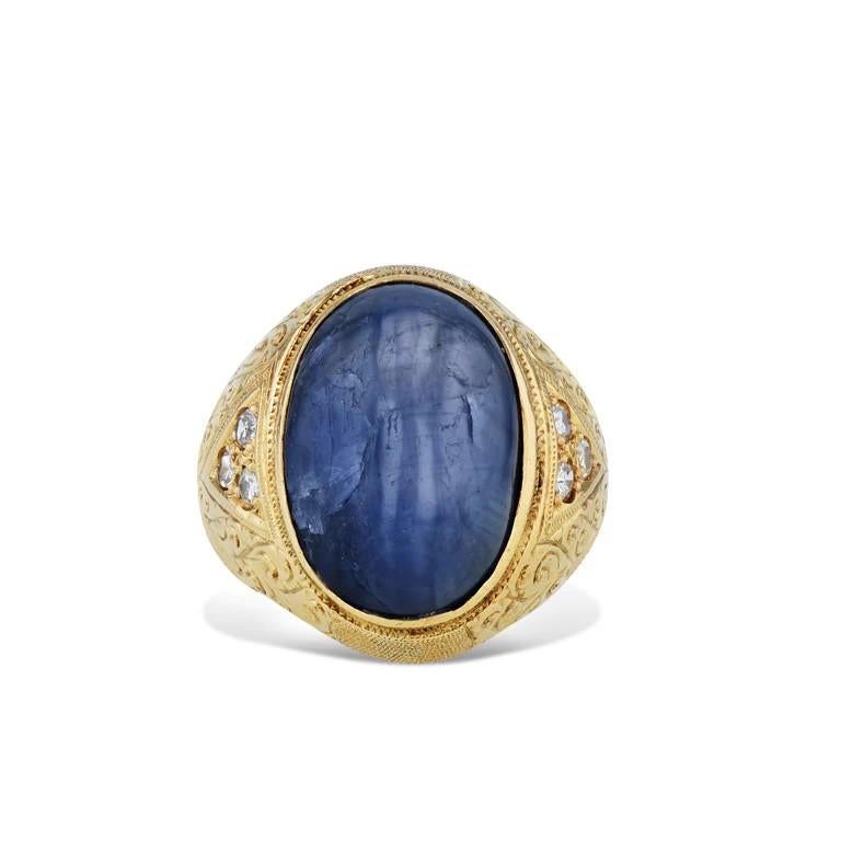 This remarkable 18 karat yellow gold blue star sapphire estate ring is a truly breathtaking sight! 

Featuring a stunning 12-13 carat blue star sapphire and 6 sparkling single cut diamonds, it's an embodiment of luxury and sophistication from the