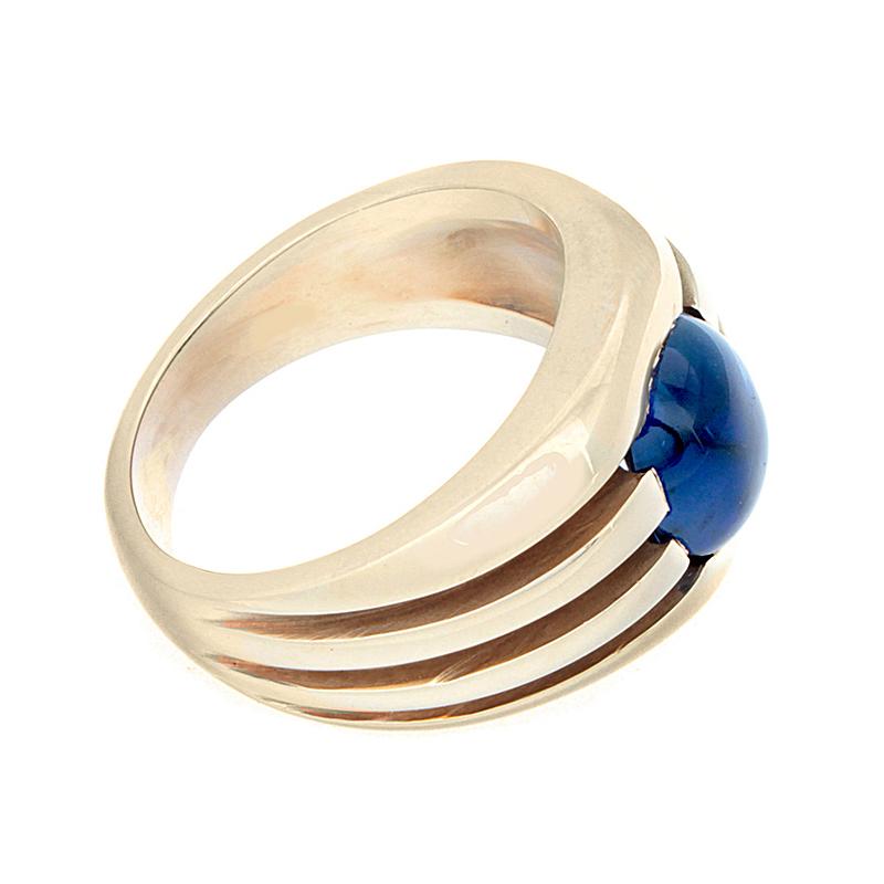 A rich and transparent gem!  A round cabochon blue sapphire weighing 5.50 carats.  The 14K yellow gold band has horizontal indents running halfway.  A ring for anyone who appreciates quality.

Currently ring size 10