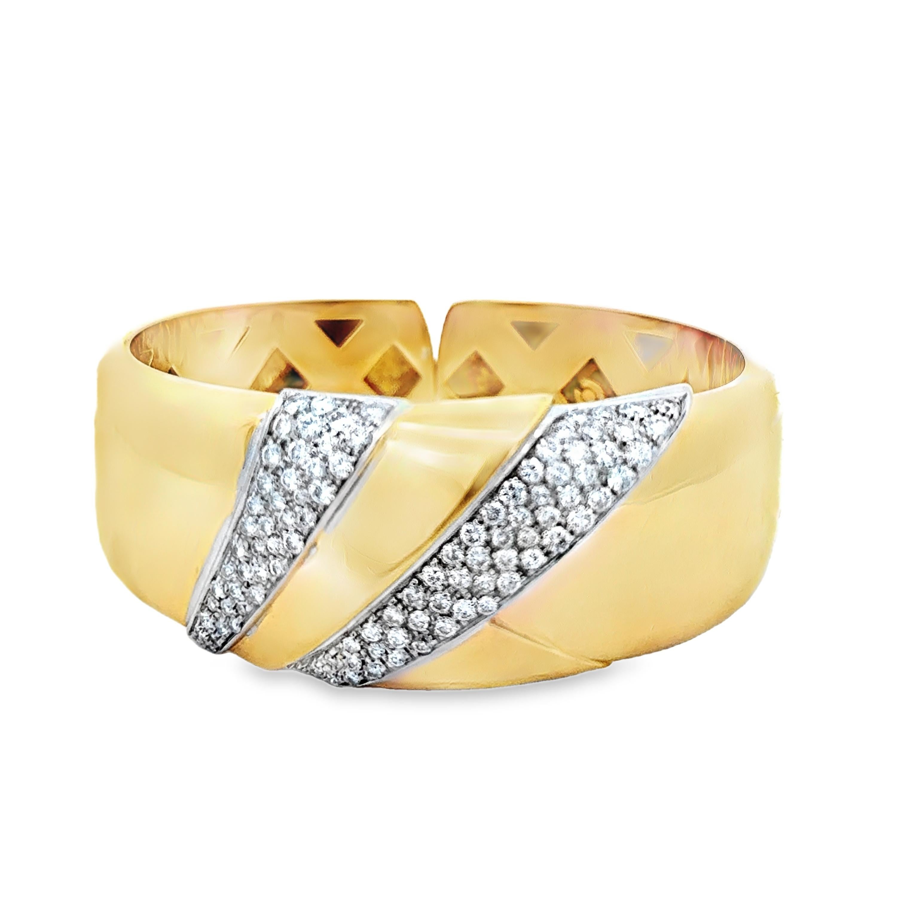 An extraordinary example of Mid-Century luxury design, this estate cuff bracelet is masterfully crafted in solid 18K yellow gold, weighing an impressive 63.37 grams. Sculptural and refined, the bold silhouette curves elegantly around the wrist,