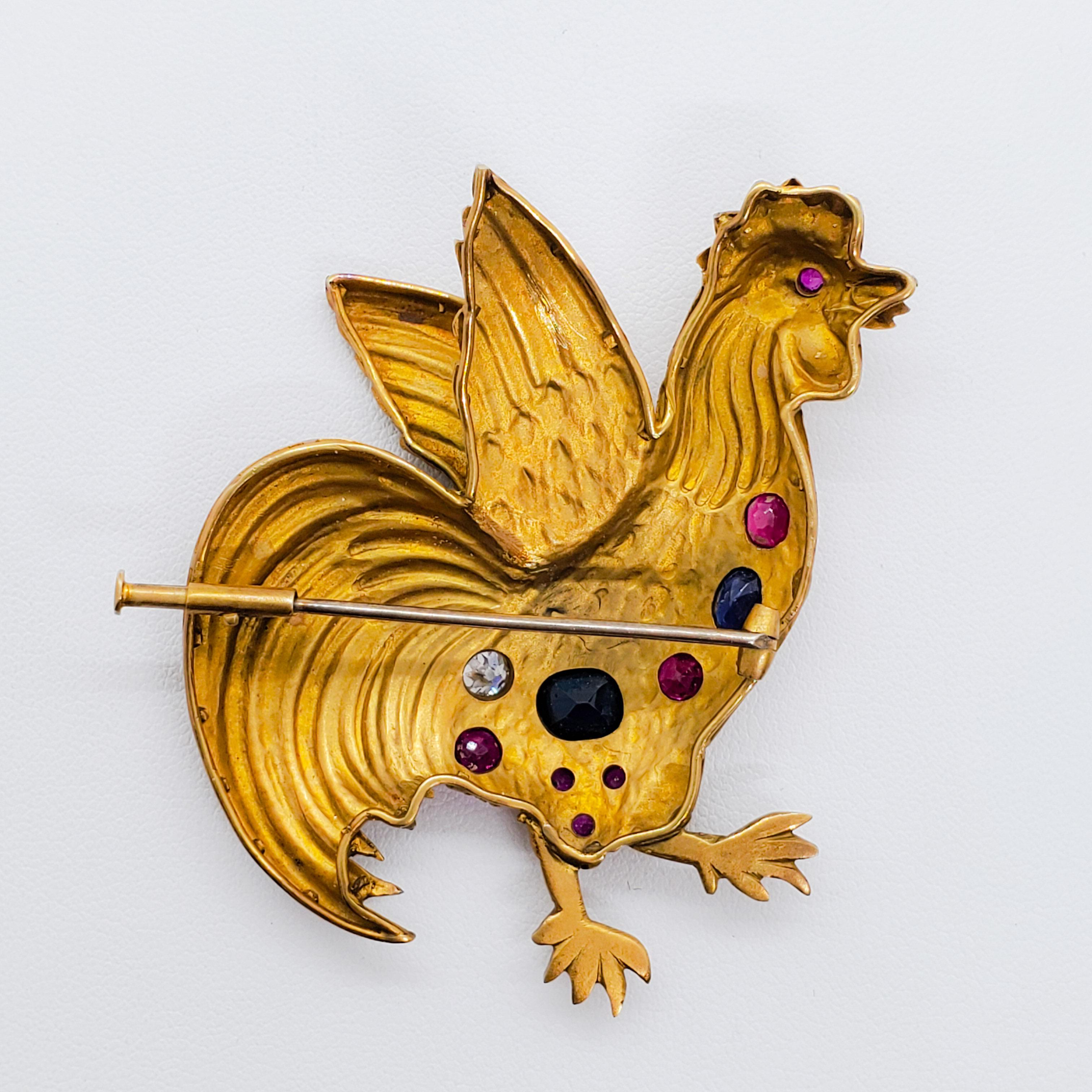 Unique rooster brooch featuring an array of multicolor gemstones and white diamond.  Approximately 28 grams of 18k yellow gold.  Handmade with attention to detail.  Excellent condition.