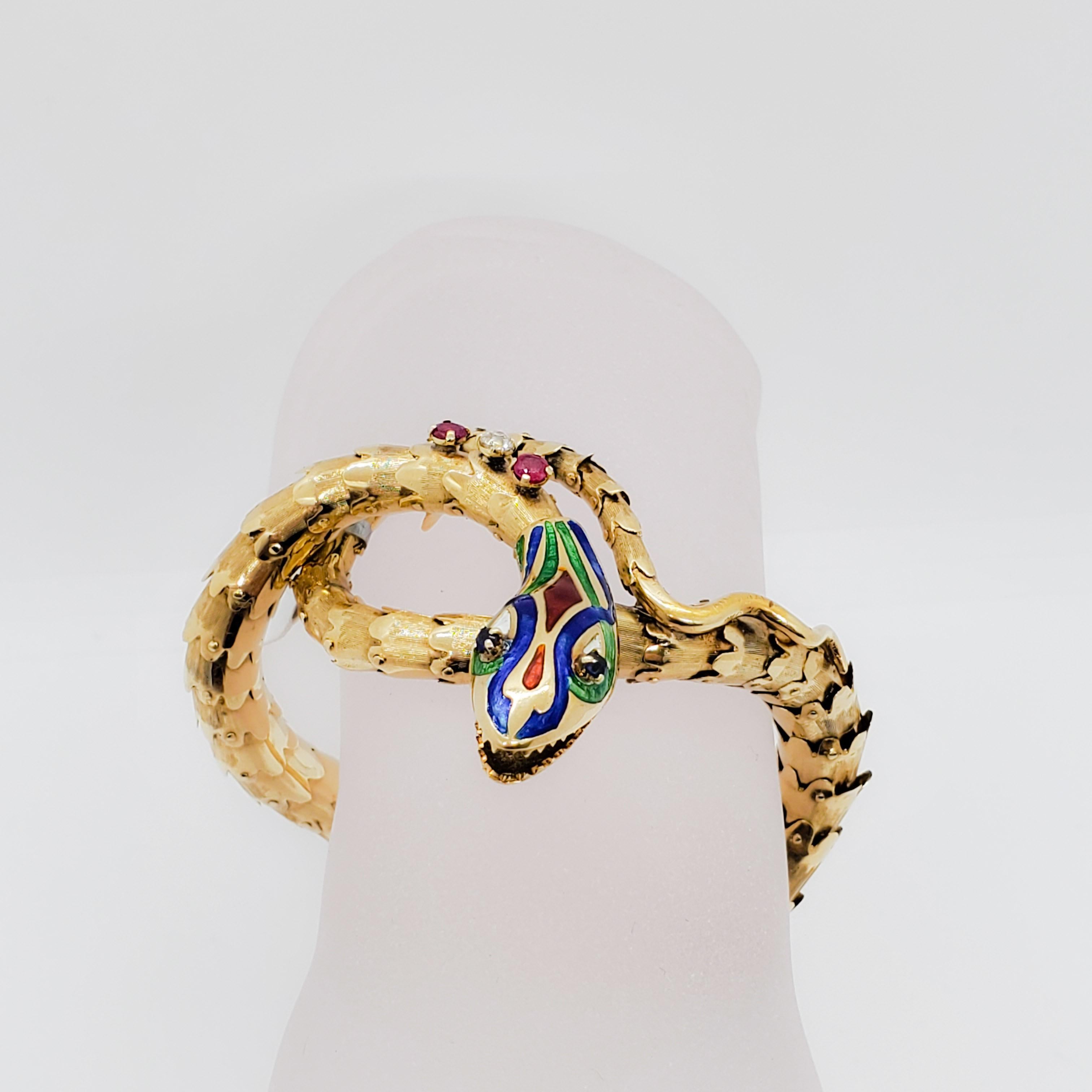 Beautiful bracelet showcasing red, blue, and green enamel on 14k yellow gold.  Good quality diamonds weigh 0.15 ct.  This item has been made very well with attention to detail and flexibility.