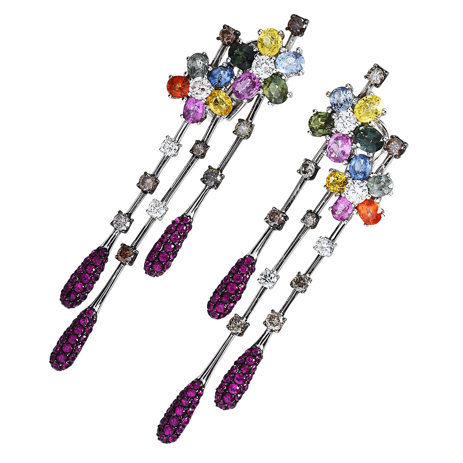 An elegant water drop, that inspires tranquility and beauty of water.

Crafted in solid 18K white gold, flower motif multi-dangle drop earrings, with a vivid color display.

Centered by Multicolor Blue, Pink, Yellow& Green sapphires, all prong &