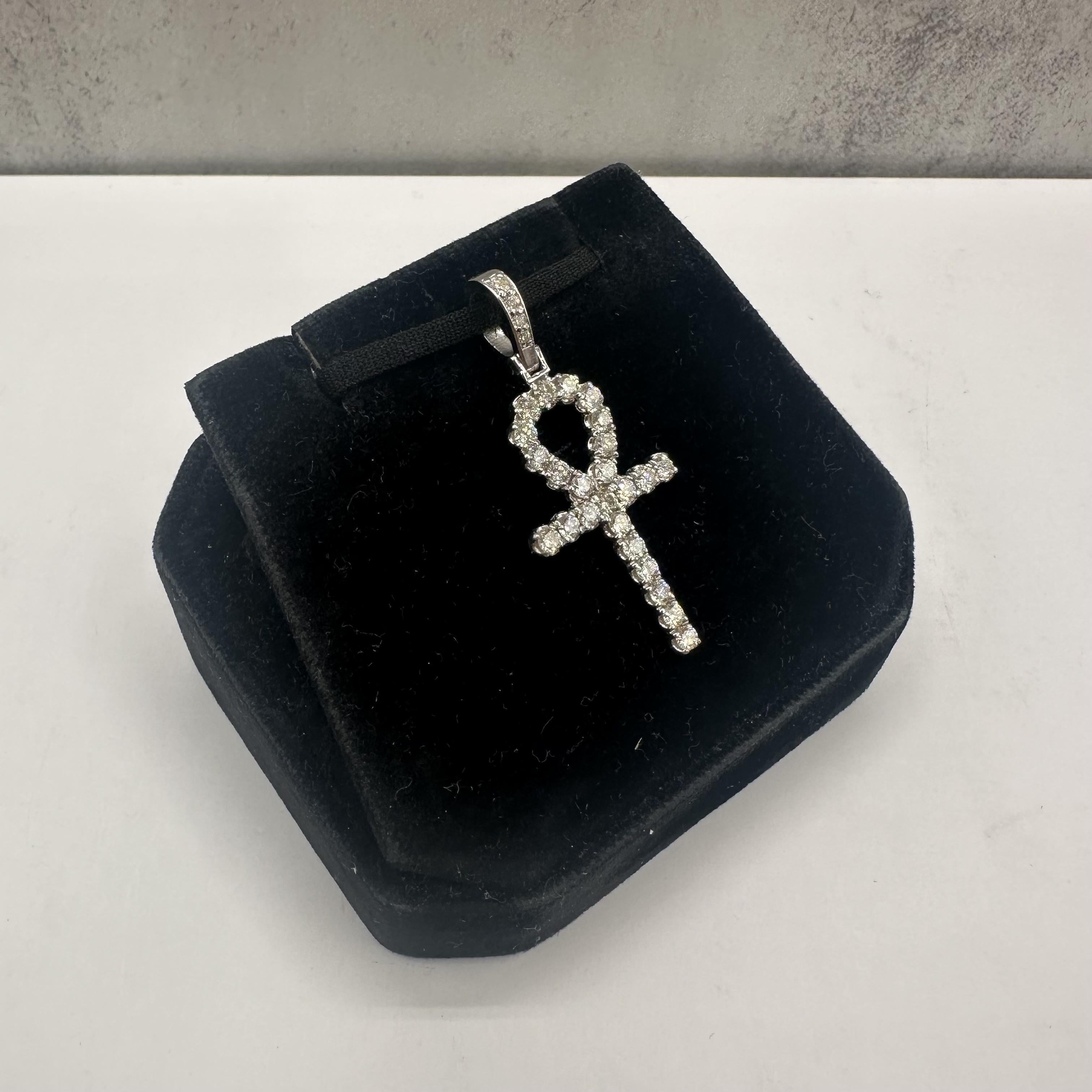 This elegant Estate Natural Diamond Ankh Cross in 14kt White Gold is a timeless piece that combines meaningful symbolism with luxurious sparkle. Featuring approximately 1.35 carat total weight (ctw) of natural GH color, VS/SI clarity round diamonds,