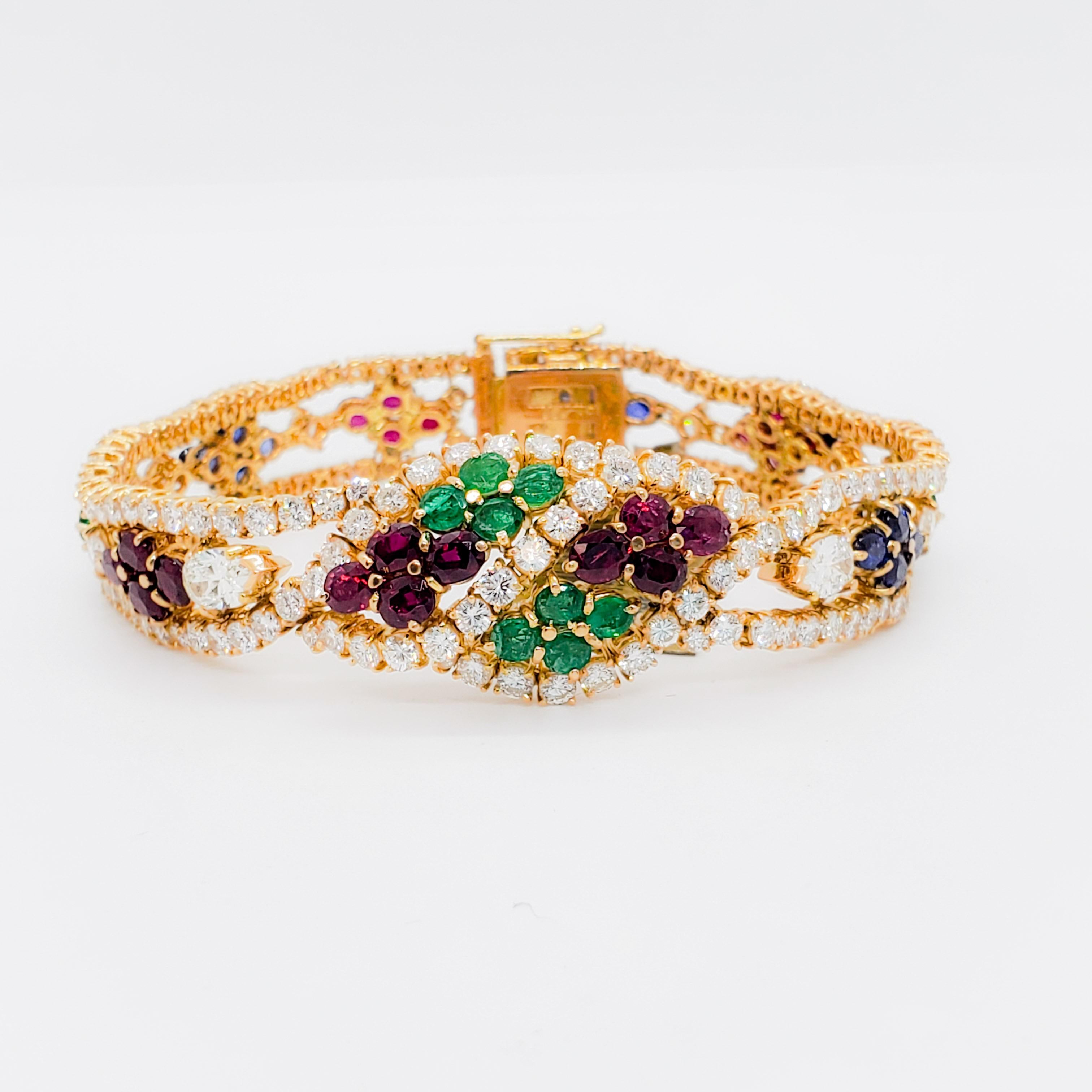 Marvelous estate Neiman Marcus set! Matching necklace, earrings, bracelet and ring all set in 18k yellow gold.  Handcrafted with 162 stones that weigh 29 cts.  Beautiful quality blue sapphires, emeralds, rubies, and diamonds in multi-shapes.  A