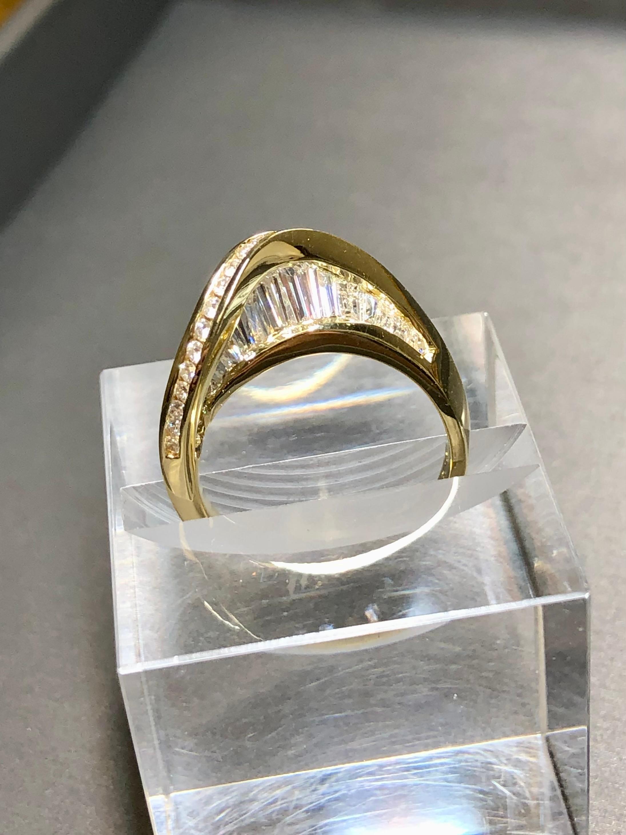 
A uniquely designed and well executed cocktail ring done in 18K yellow gold by NOVA STYLES and set with approximately 2cttw in round and tapered baguette diamonds. All stones are a matching G-H color and Vs1+ clarity.


Dimensions/Weight:

Ring