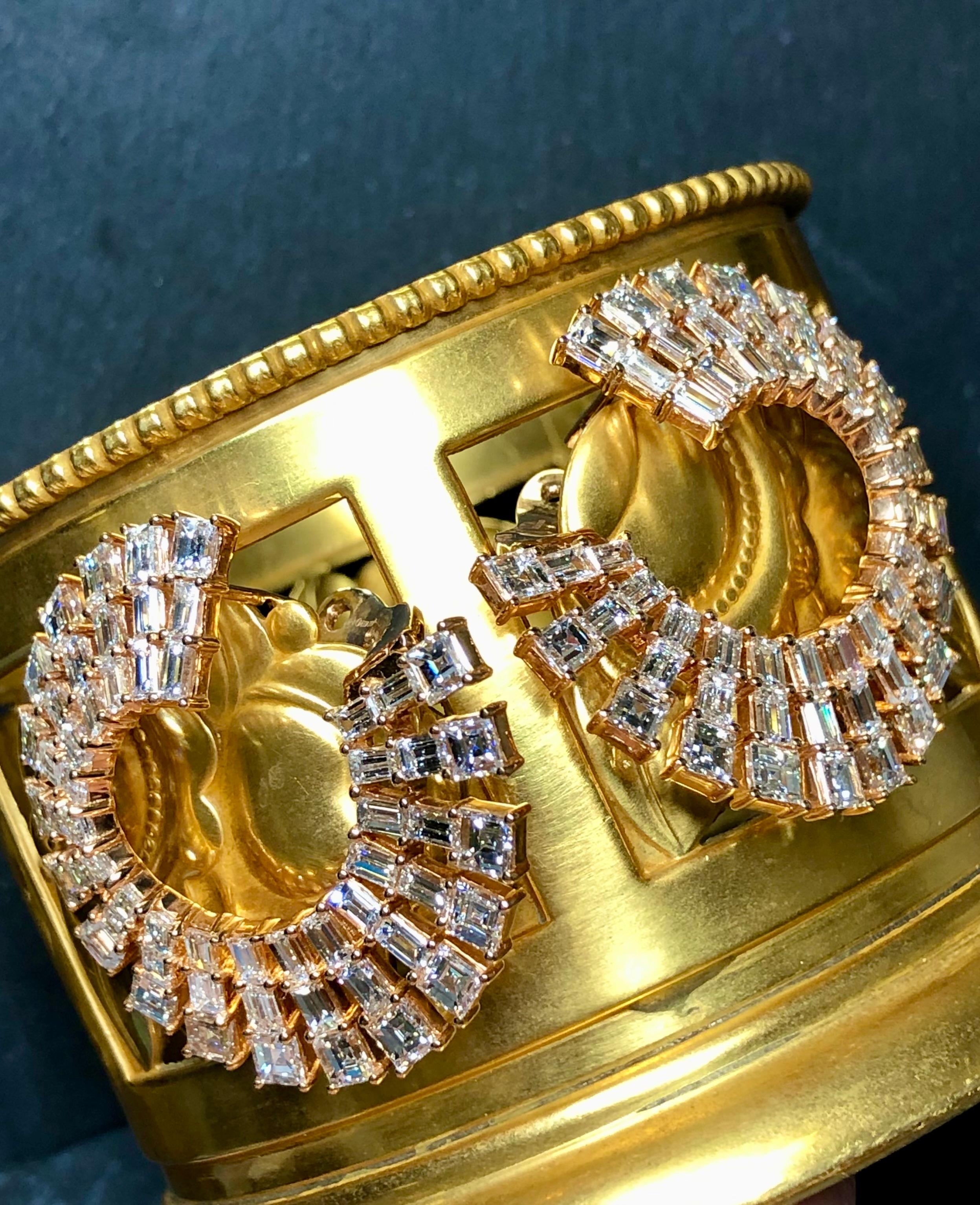 The only word for these is sensational! Done in 18K rose gold, these ODELIA earrings are set with LARGE square step cut and long baguette diamonds totaling approximately 20ctw and all range G-I in color and Vs1-2 in clarity. The wonderful thing