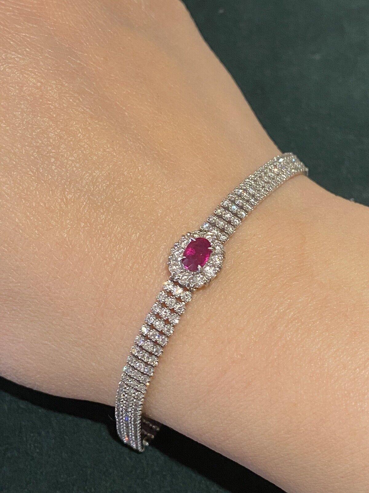 Estate Oval Ruby & Diamond Bracelet in Platinum

Estate Oval Ruby and Diamond Bracelet features a 0.72 carat Oval Ruby in the center, accented by 238 Round Brilliant-cut Diamond forming a three row bracelet, all set in Platinum.

Total ruby weight