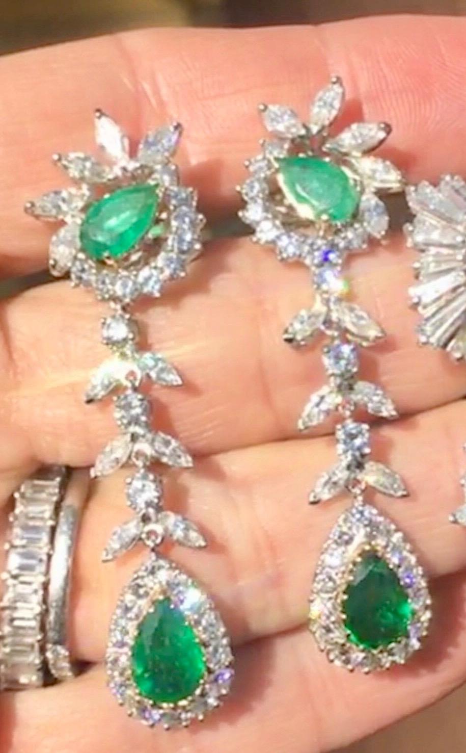 These amazing estate emerald diamond pendnat earrings are the epitome of chic, elegant, classy and high sparkle & drop dead gorgeous color!  Shown here are various inside / outside pictures. They will light up and glow when they hit sunlight or more