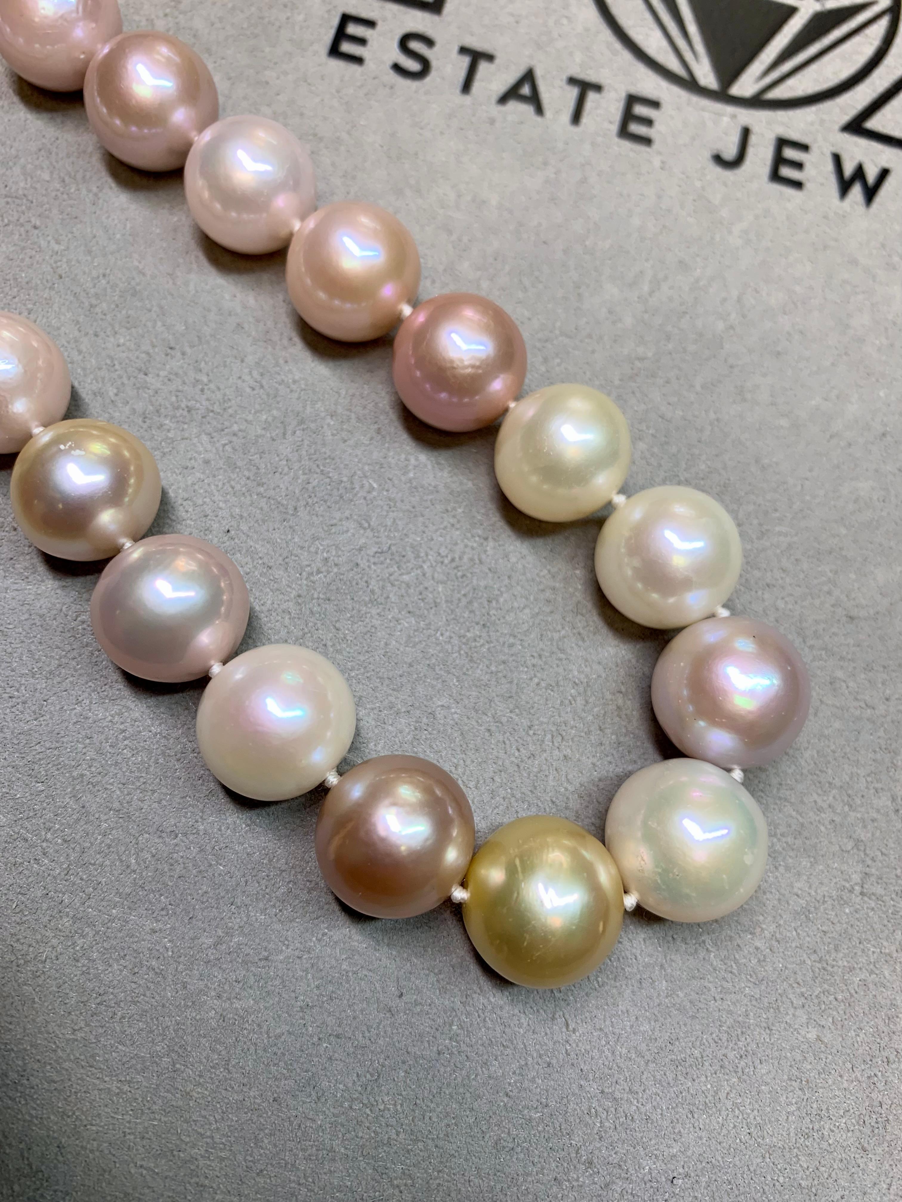 A luxurious strand of large South Sea pearls that are sure to please the most discerning of pearl buyers. These pastel colored beauties range in size from 12.68mm at the smallest to 15.20mm at the largest and are finished with a beautifully detailed