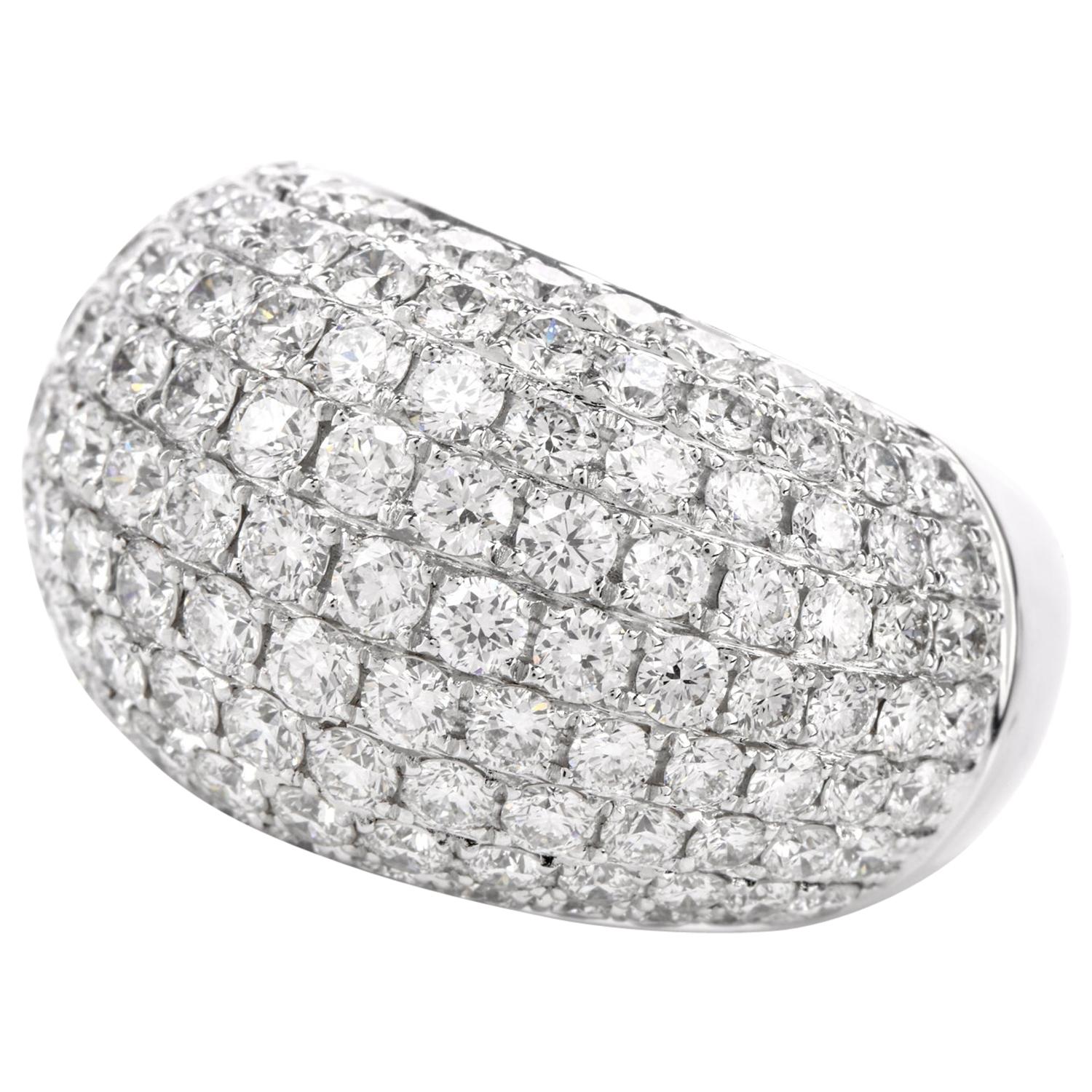This bright white Diamond Cocktail ring was inspired in a Dome Bombe motif and crafted in 18 Karat White Gold. Hand-Set with high quality white diamonds adorn the arch of this ring weighing approx. 5.50 carat and are of G-H color and range from