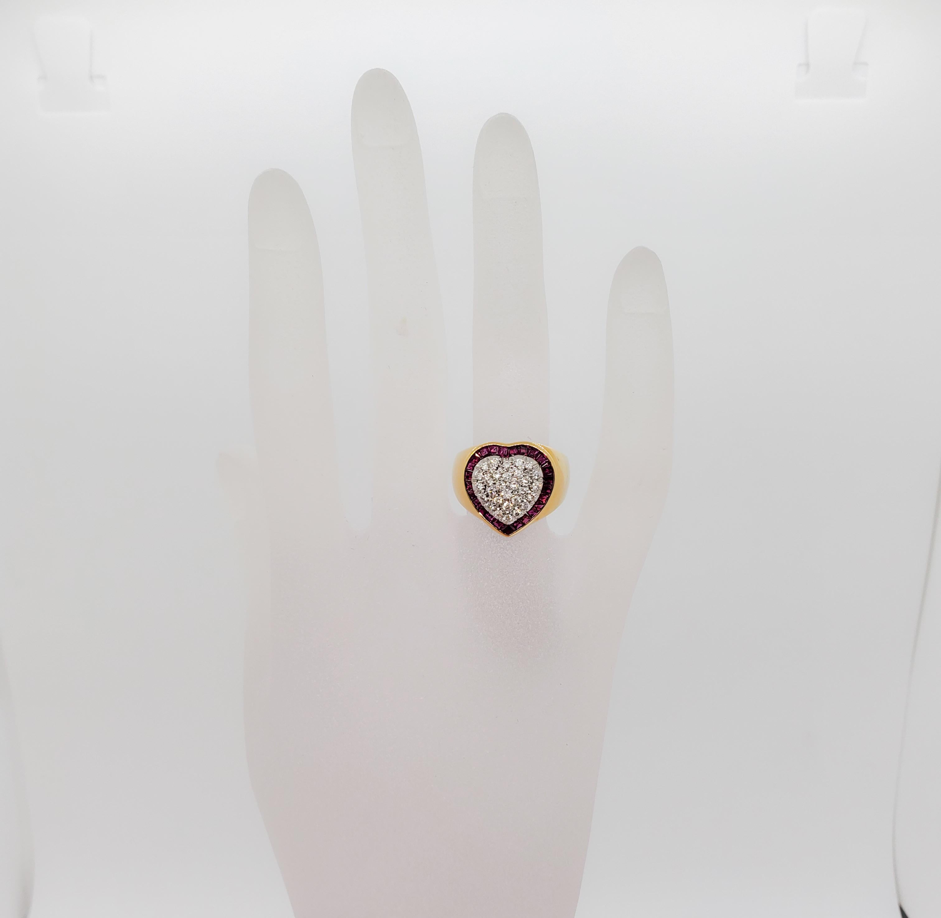 Beautiful estate ring in the shape of a heart. This ring has 1.20 ct. of good quality, white, and bright diamond rounds in pave as well as 0.41 ct. of bright red ruby squares. A very unique display in a classic heart shape. Handmade in 18k yellow