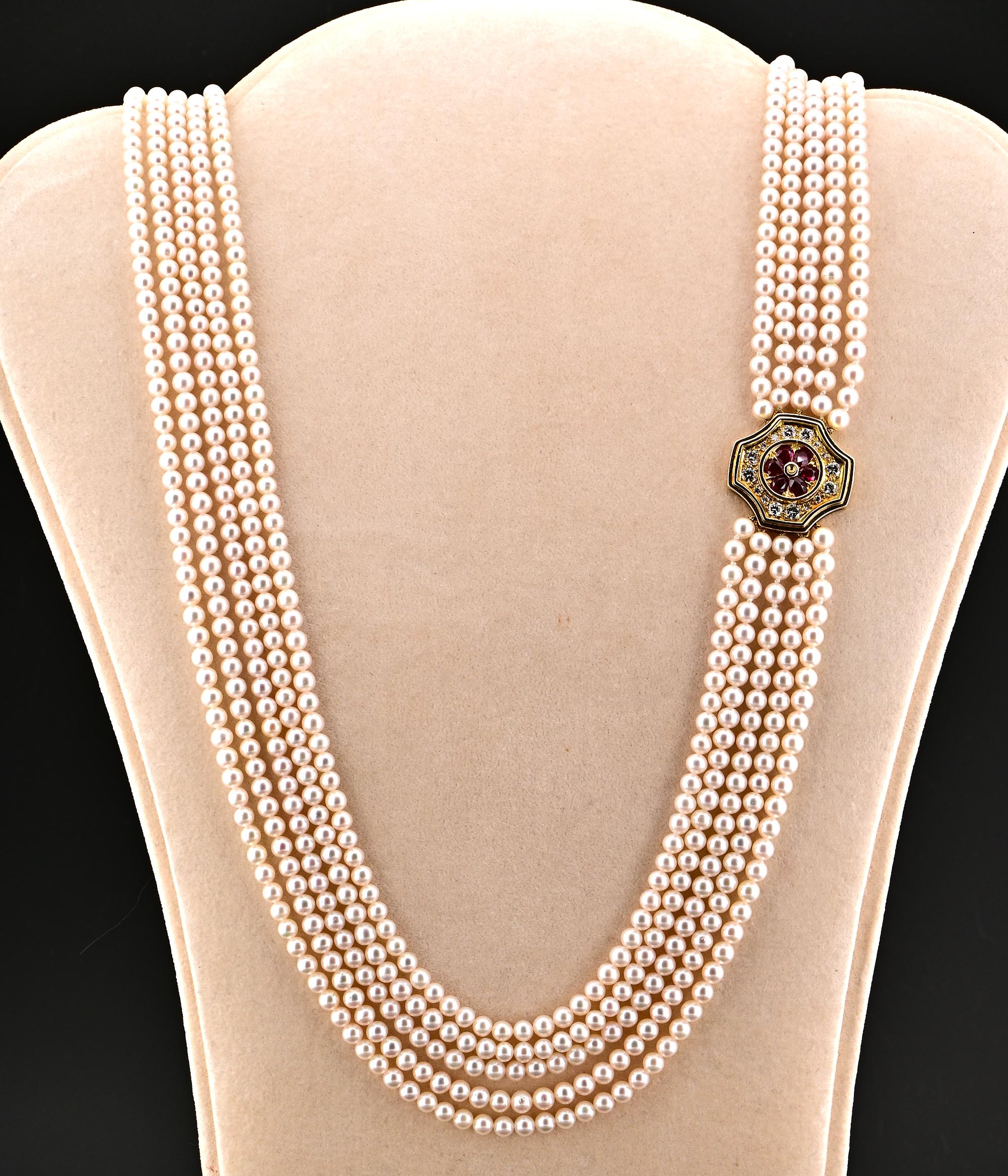 Elegance Spotlight
This unique vintage Pearl Ruby & Diamond suit is the epitome of timeless elegance, hand crafted 18 kt gold components bearing English hallmarks for London 1977
The suit consists of a long five strands Pearl necklace enriched by a