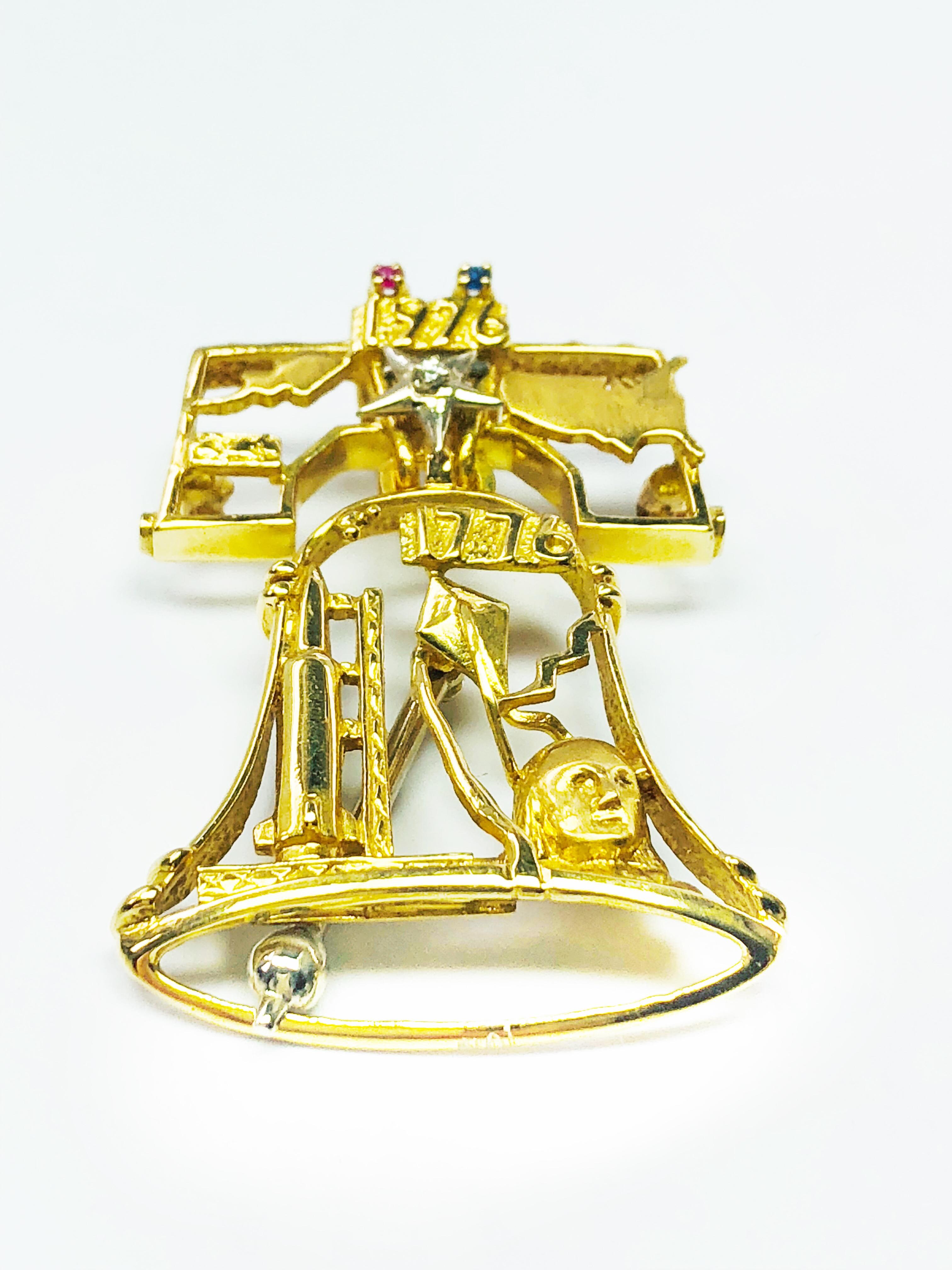 This is a beautiful Estate Piece! Designed by Peter Lindeman this piece commemorates the Bicentennial Celebration!  It is made in 18k yellow Gold and has a Platinum moveable Clapper. Above the 