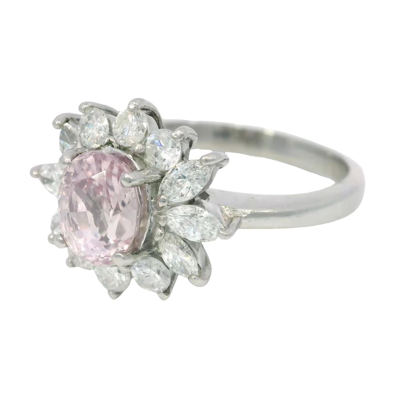 Estate Pink Sapphire Diamond Cluster Platinum Ring Size 6.75 ~2.33ctw 

This exquisite ring features a central oval-cut pink sapphire, surrounded by a radiant halo of marquise-cut white diamonds in a floral cluster design. The soft pink hue of the