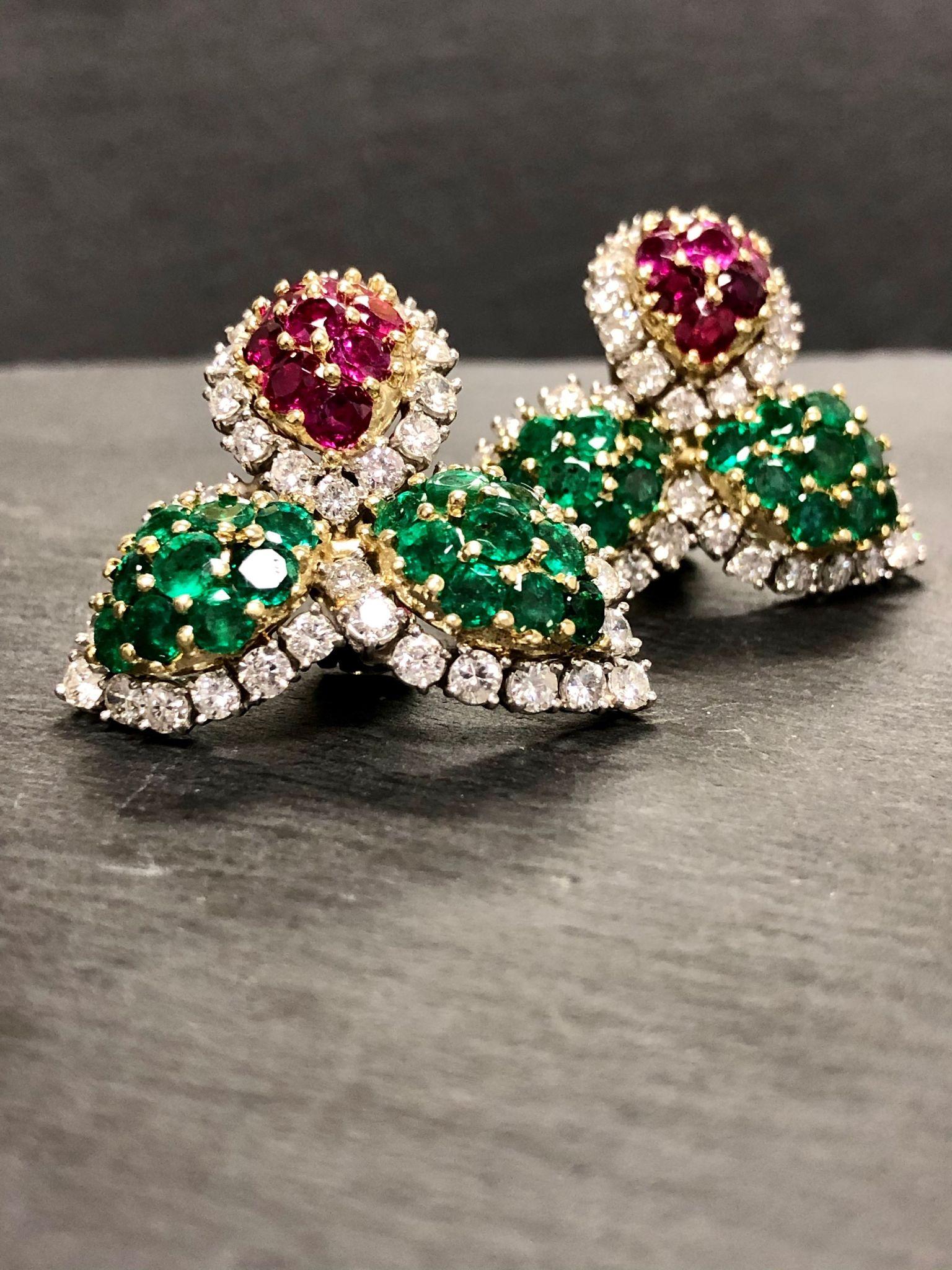 A vintage pair of statement earrings done in platinum and 18K set with approximately 6.50cttw in G-I color Vs2-Si2 clarity diamonds as well as approximately 3.60cttw in natural rubies and 5.40cttw in natural emeralds.

Dimensions/Weight
1 1/4” by 1