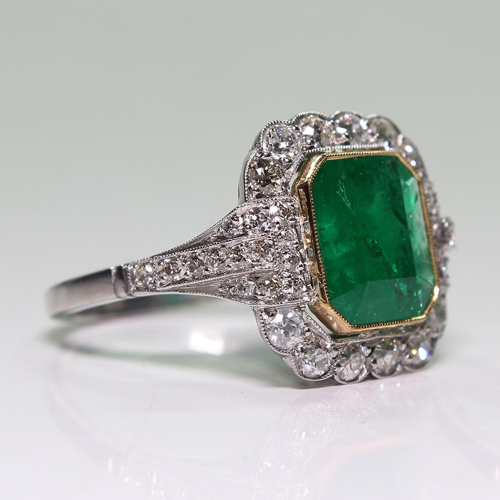 Period: Art Deco (1920-1935)
Composition: Platinum
Stones:
•	1 natural Colombian emerald that weighs 2.94ctw.
•	40 Old mine cut diamonds of H-VS2 quality that weigh 0.95ctw. 
Ring size: 6 ¾   
Ring face:  17mm by 15mm 
Rise above finger: 6mm.¬
Total